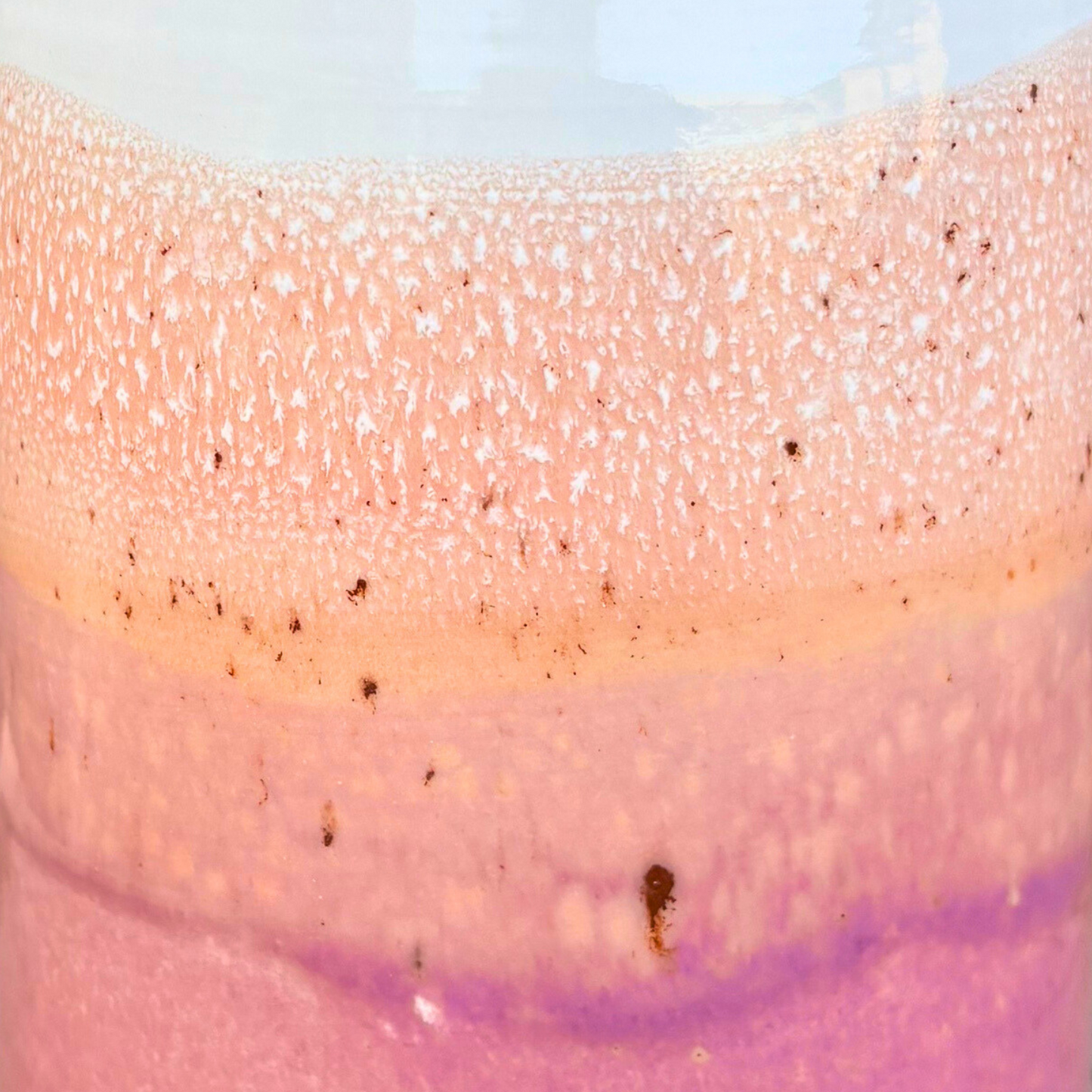 Close-up of a pink and purple gradient with glittery texture