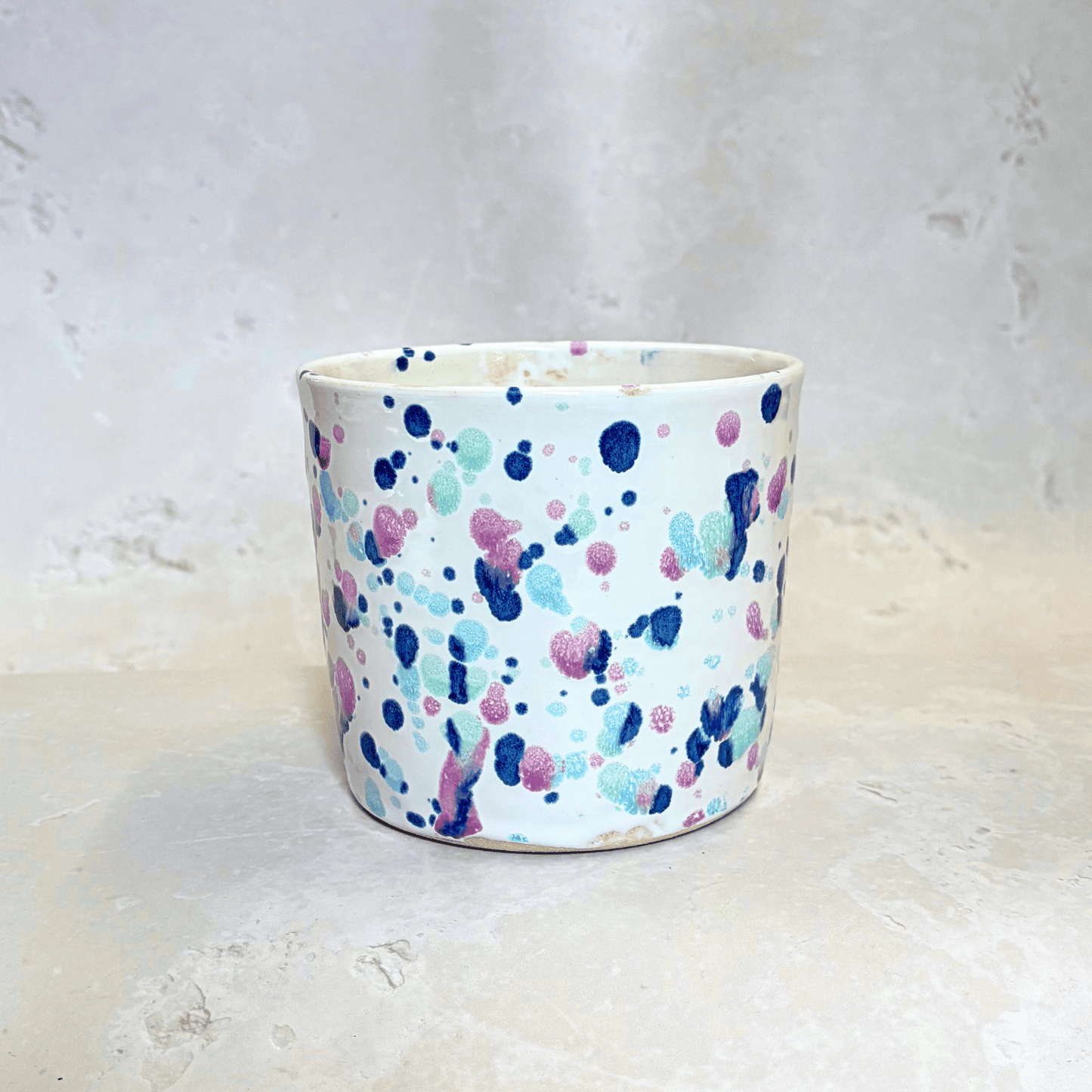 Ella Fletcher Designs Handmade Ceramic Pot in Sweetpea design, white background with splatters of blues and pinks