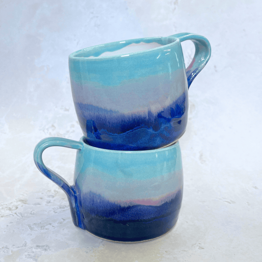 Ella Fletcher Designs Handmade Ceramic Large Round Mugs in Scottish Sunrise Landscape Design, layers of blues and pinks inspired by the Scottish Sunrise and landscape
