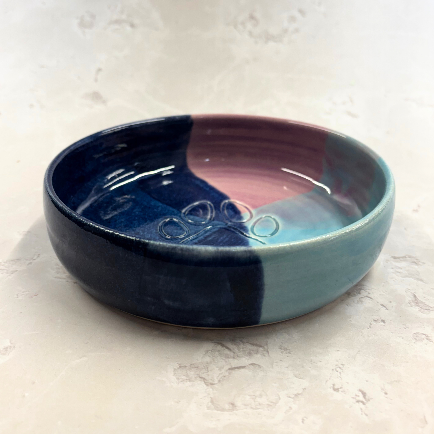 Ella Fletcher Designs handmade Ceramic bowl with blue and pink gradient on a light gray background