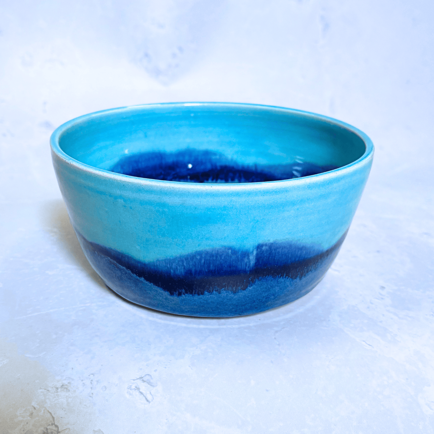 Ella Fletcher Designs Handmade Ceramic Ramen Bowl in Blue Landscape Design, light and dark blues layered on a tall edged bowl