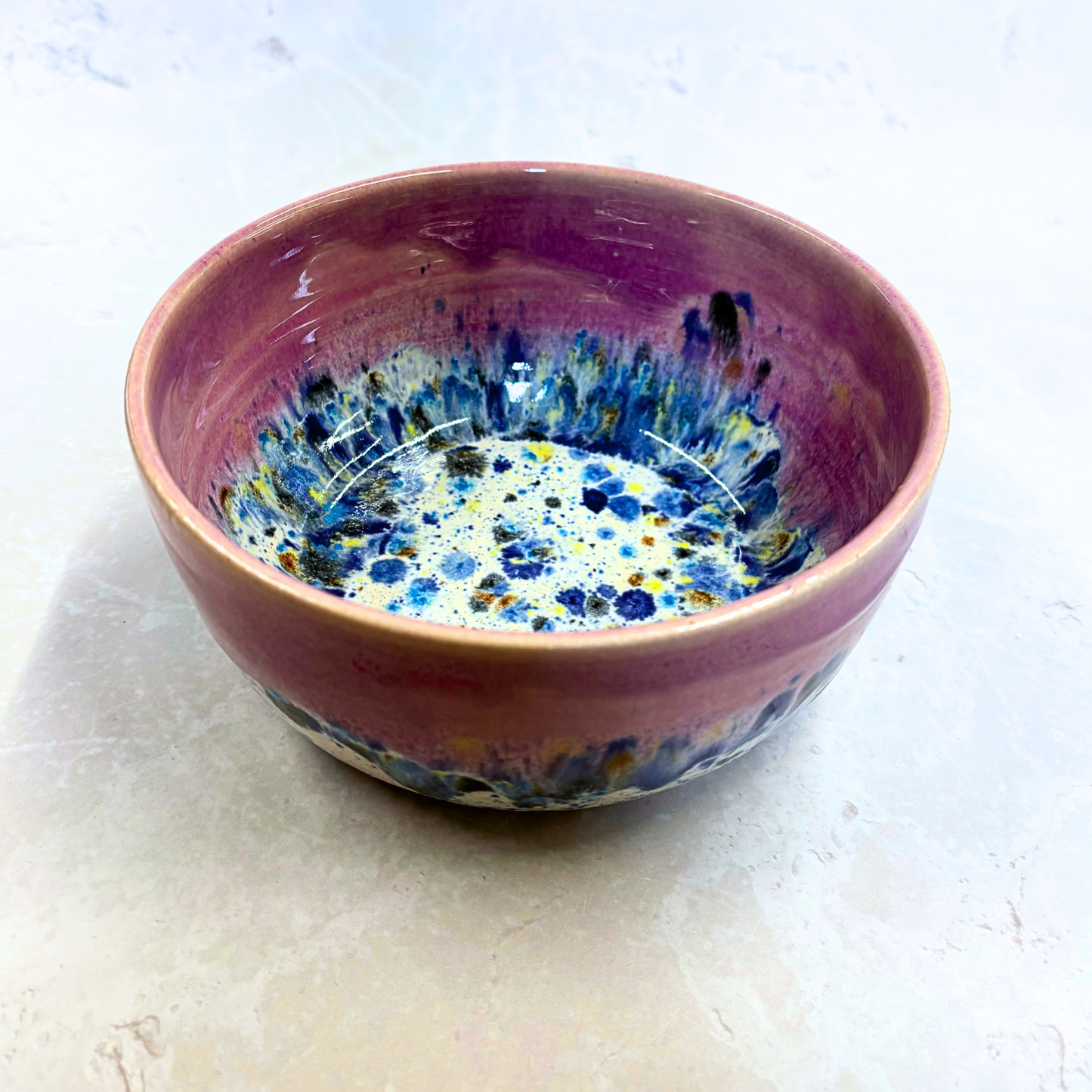 Ella Fletcher Designs Handmade Ramen Bowls in Pink Shoreline, bowl with solid pink melting into multi-coloured speckles on a white background