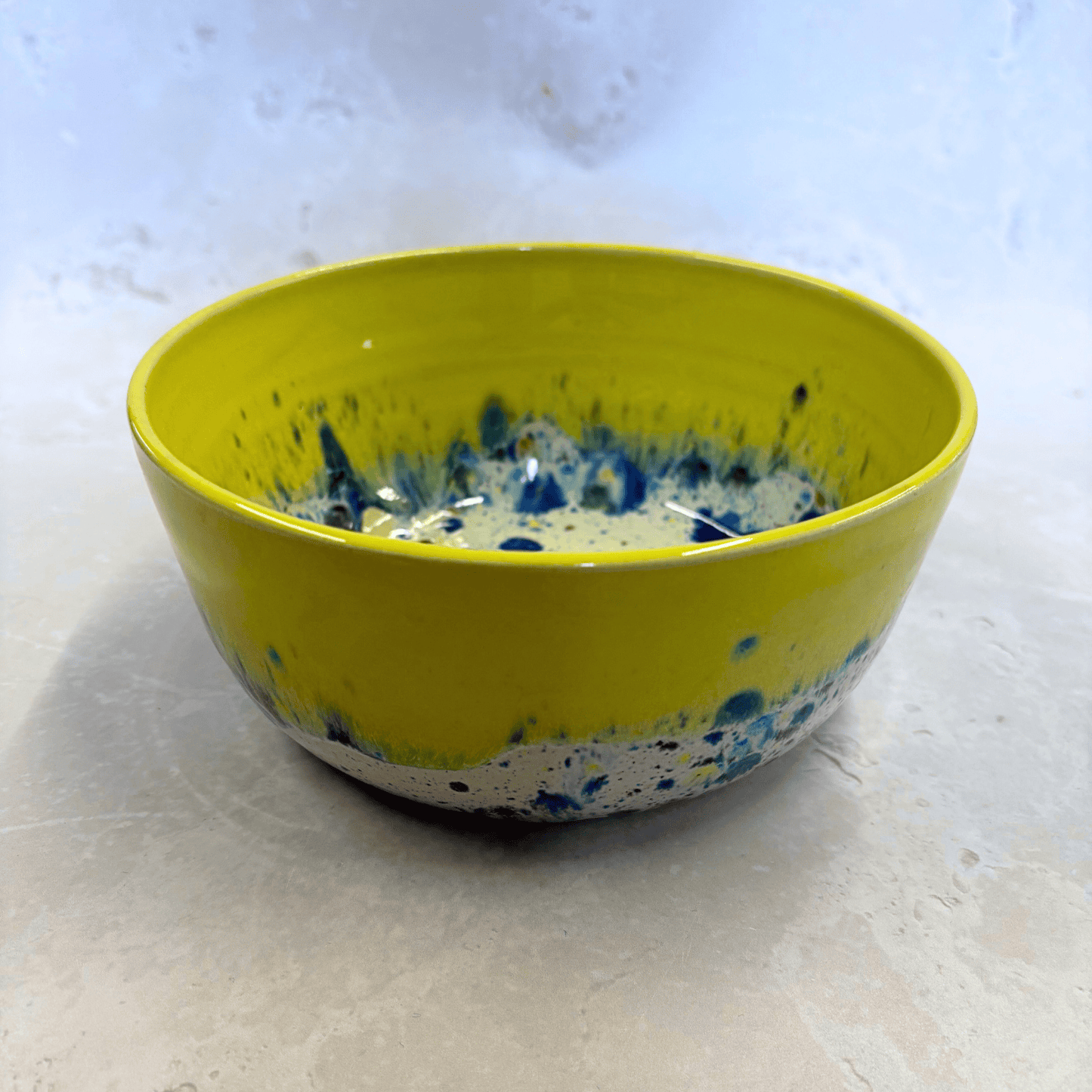 Ella Fletcher Designs Handmade Ramen Bowl in Yellow Shoreline, bowl with solid yellow melting into multi-coloured speckles on a white background