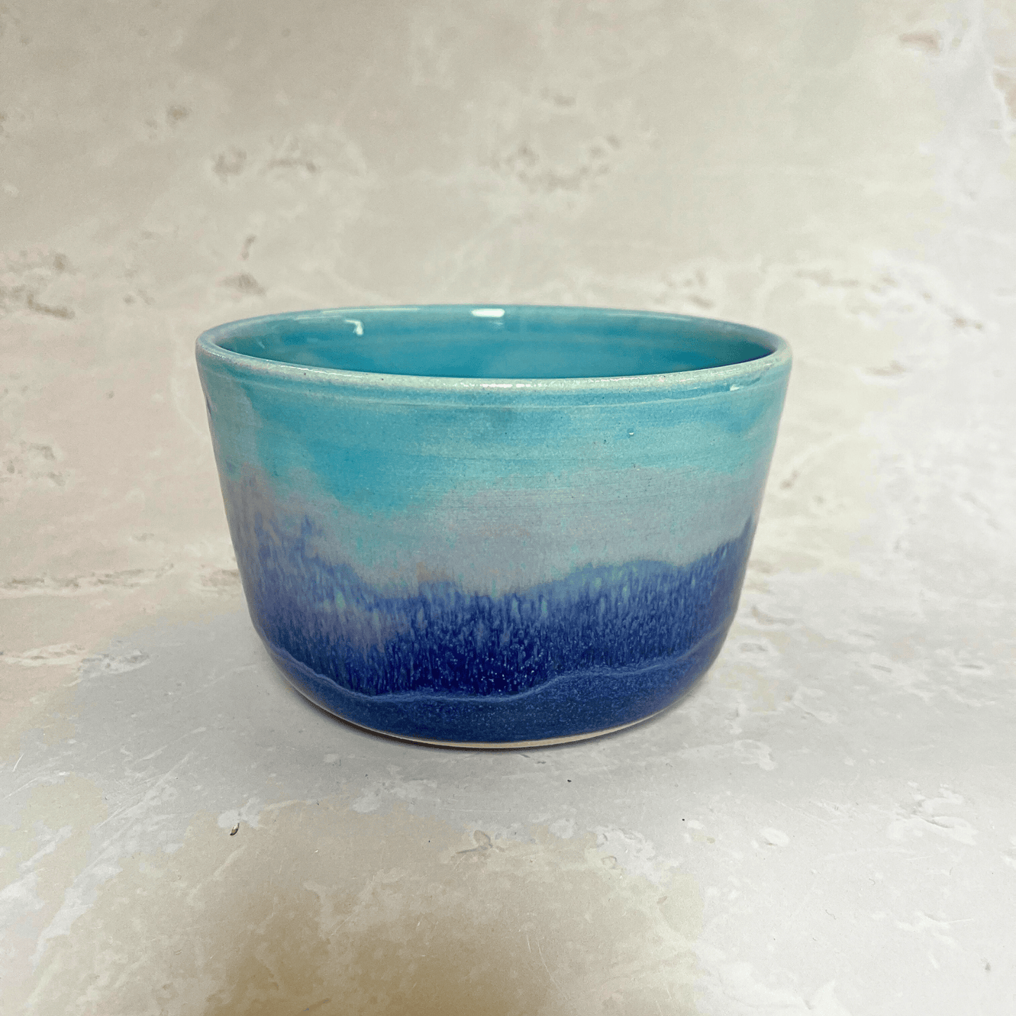 Ella Fletcher Designs Handmade Ceramic Small Bowl in Sunrise Landscape, layers of pinks and blues on a small bowl