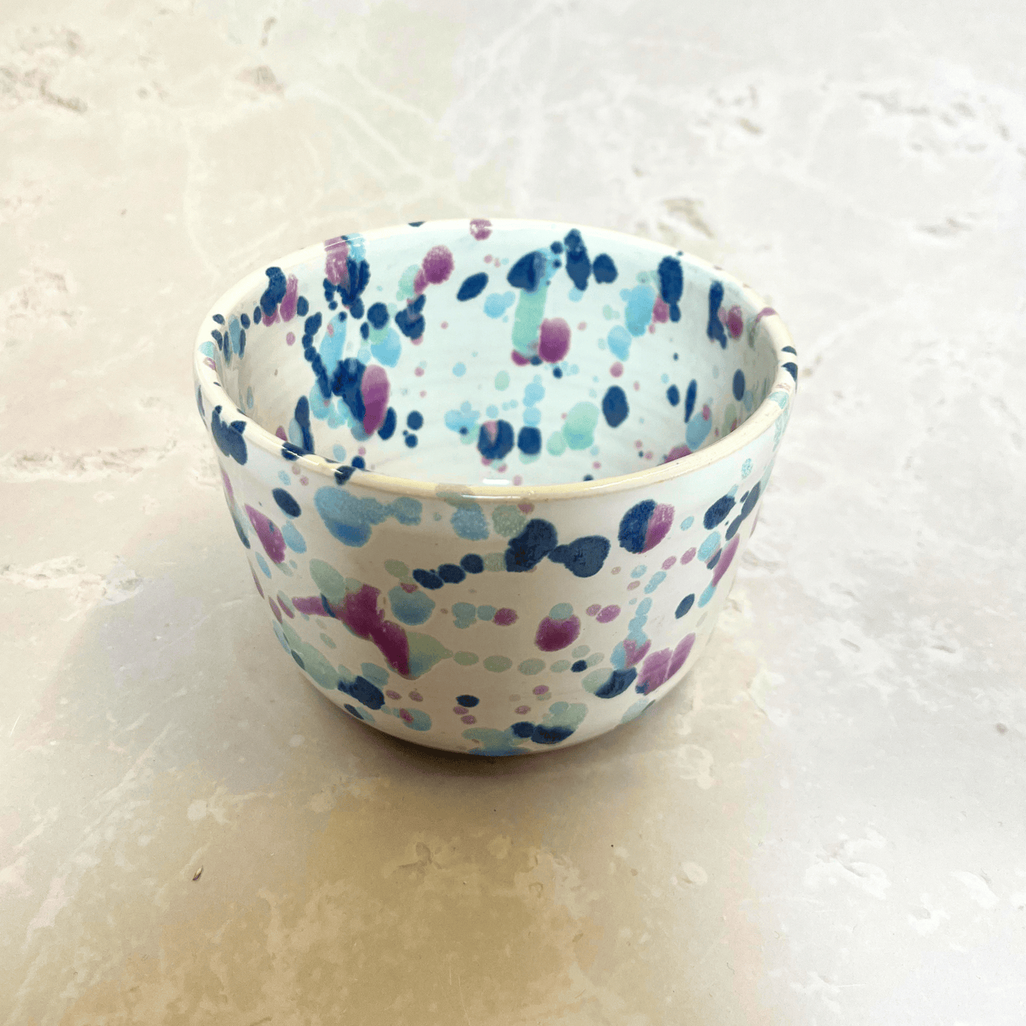 Ella Fletcher Designs Handmade Ceramic Small Bowl in Sweetpea, bowl with white background and splatters of blues and pink
