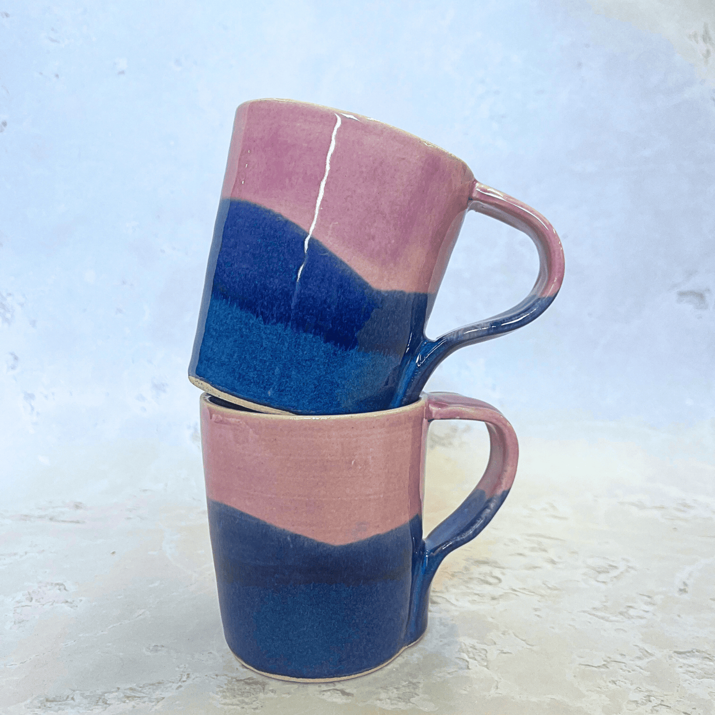 Ella Fletcher Designs Handmade Ceramics Standard Mug in Pink Scottish Landscape Design, layers of blues and pinks resembling the Scottish landscape
