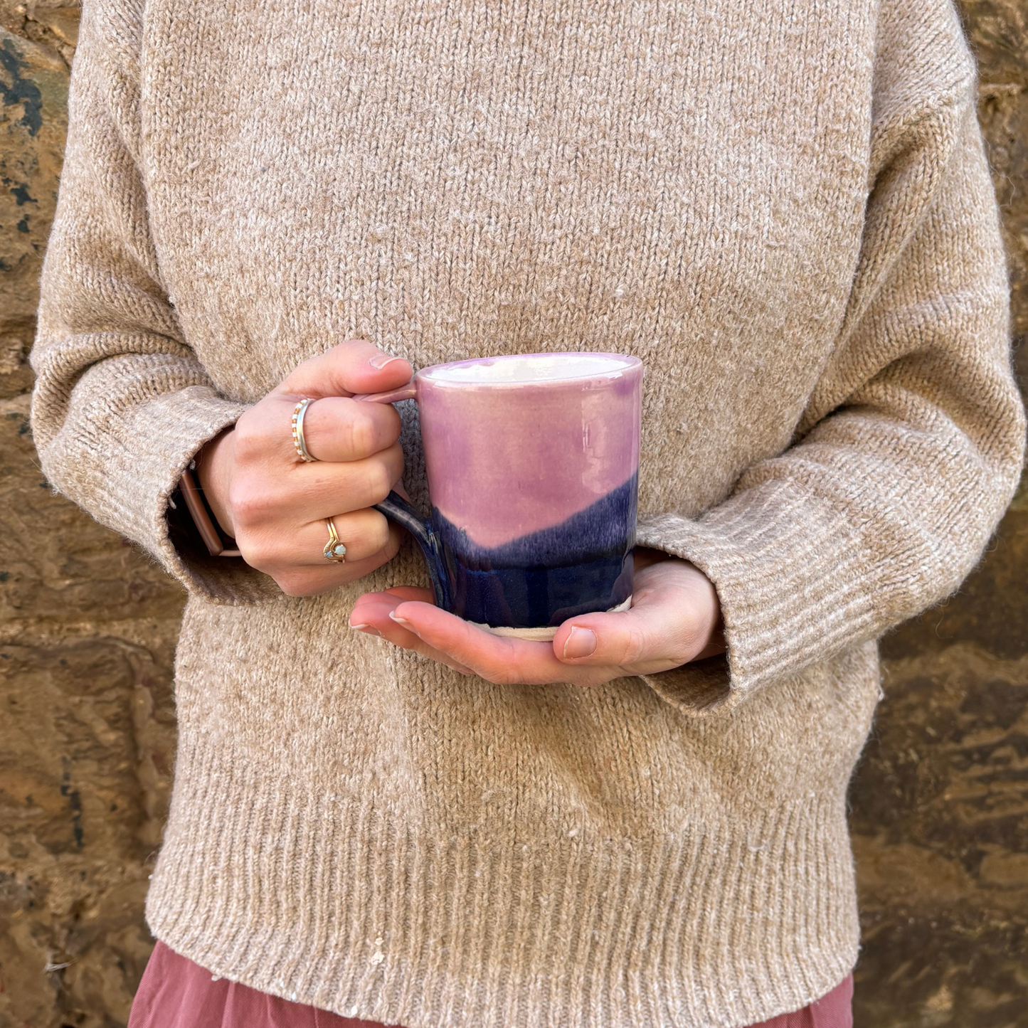Ella Fletcher Designs Handmade Ceramics mug in pink landscape design being held