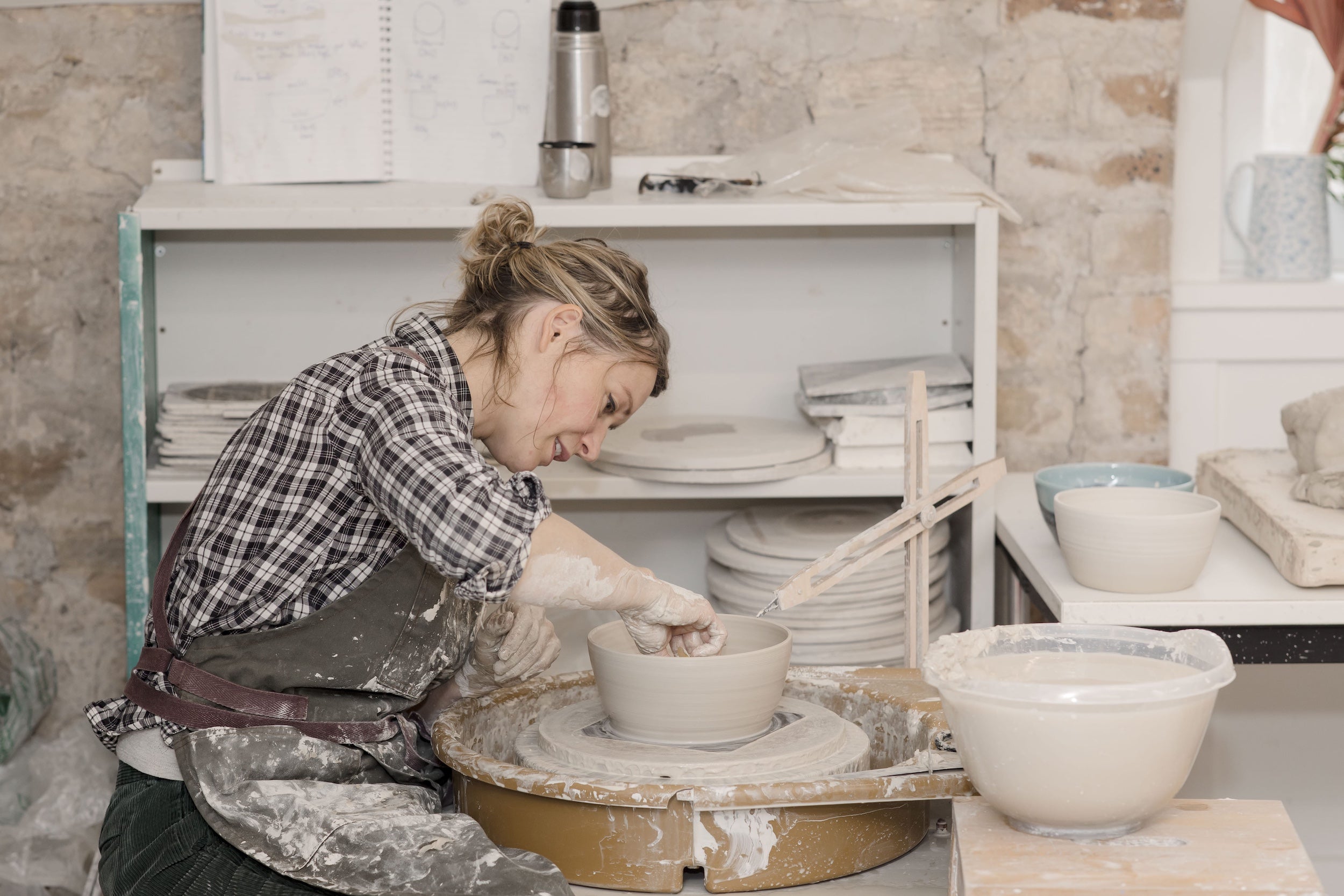 Ella Fletcher Designs Handmade Ceramic potter at wheel making a ramen bowl