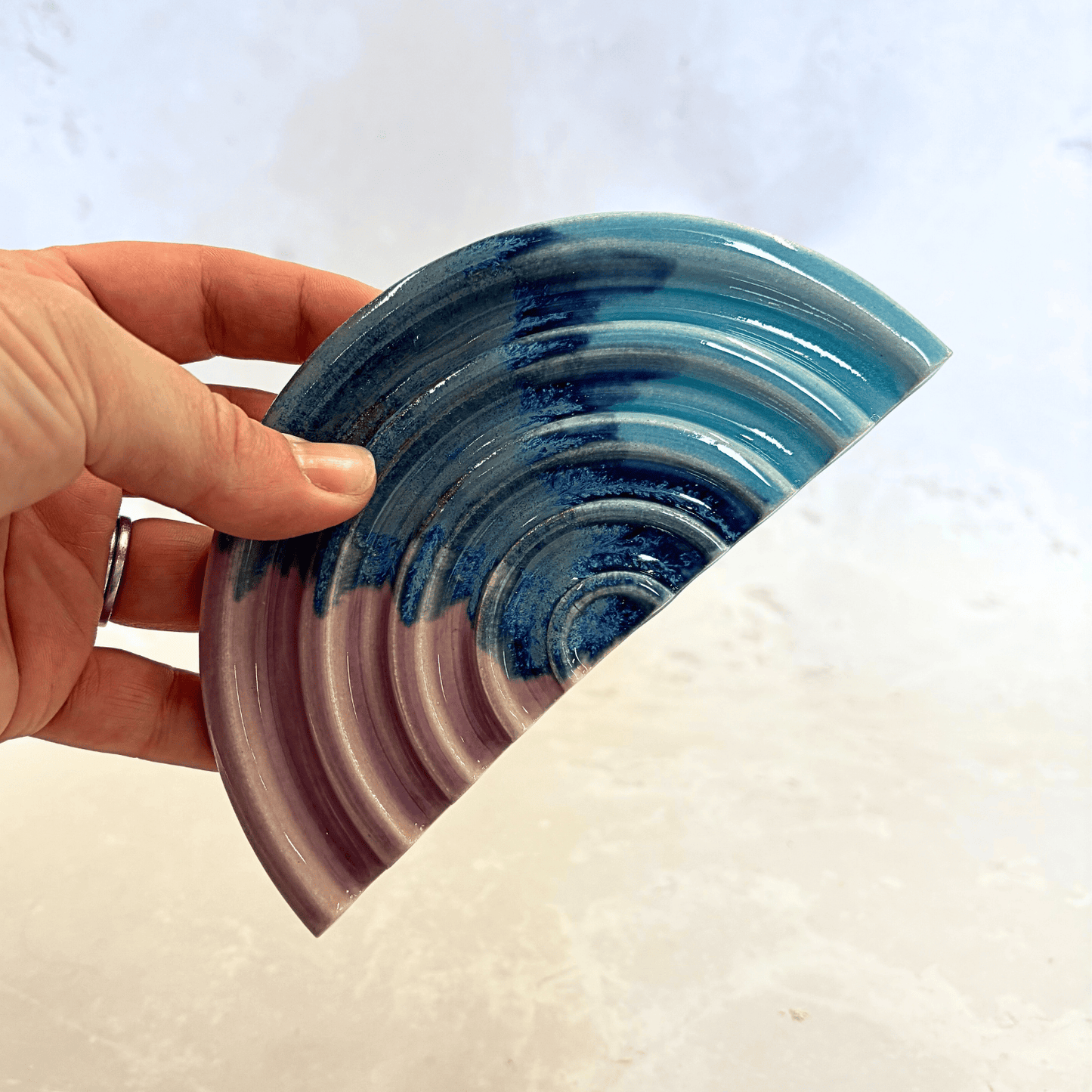 Ella Fletcher Designs Handmade Ceramics Soap Dish Scottish Sunrise Landscape, semi-circle dish with ridges in layers of blues and pink