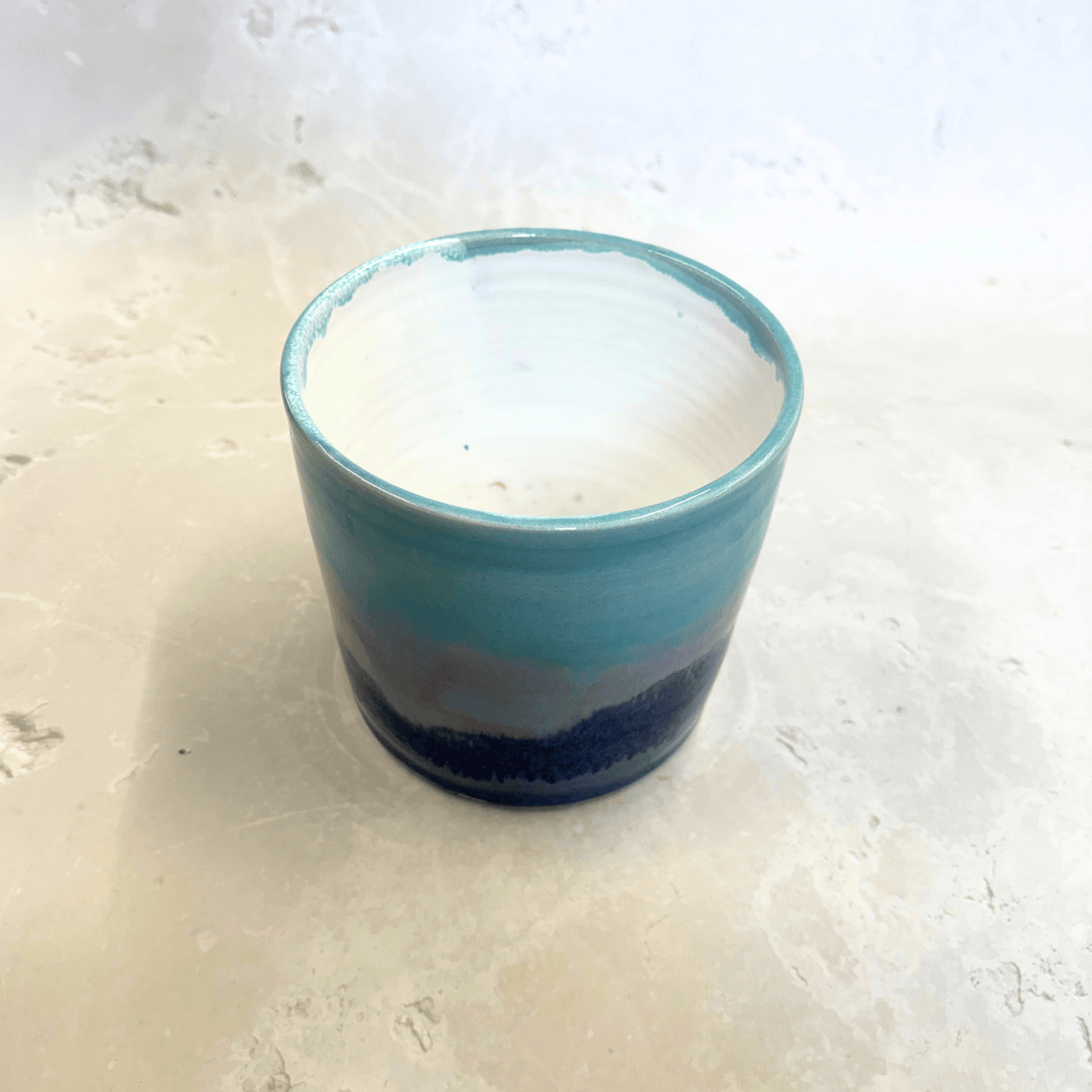 Ella Fletcher Designs Handmade Ceramic Pot in Scottish Sunrise Landscape, plant pot with layers of blues and pinks