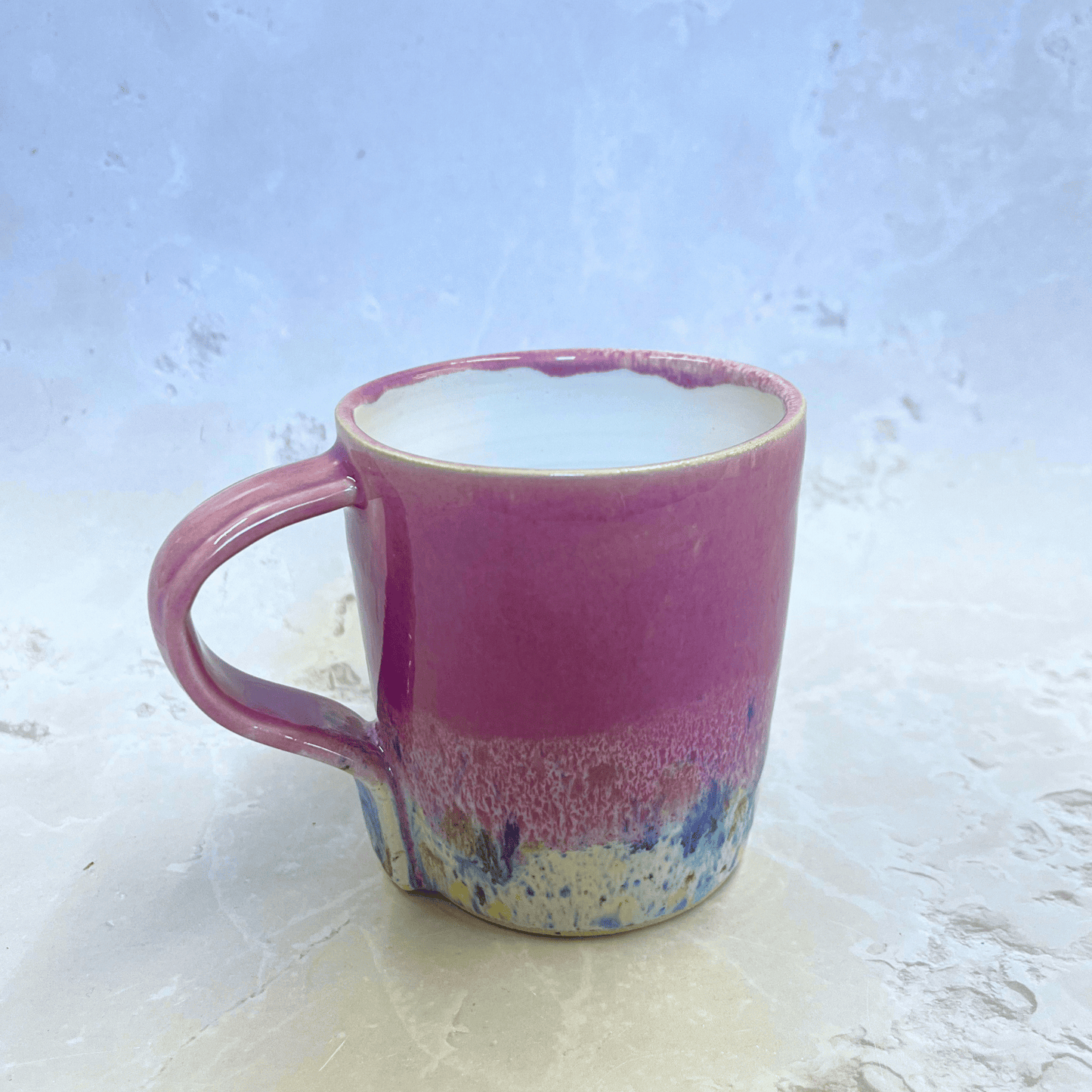 Ella Fletcher Designs Handmade Pottery Mug in Pale Pink Shoreline Design, pale pink top half with speckled bottom half inspired by the shoreline at East Lothian beaches