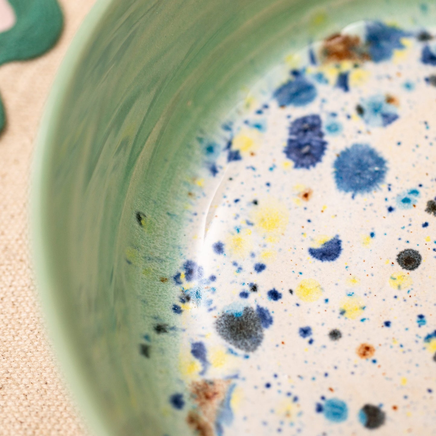Ella Fletcher Designs Handmade Ramen Bowl in Green Shoreline, close up view of green and multicoloured speckles
