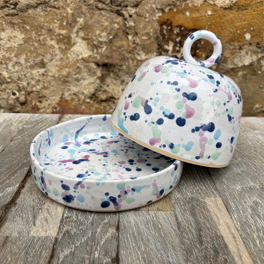 Handmade Ceramic butter dish with white background and splatter glaze