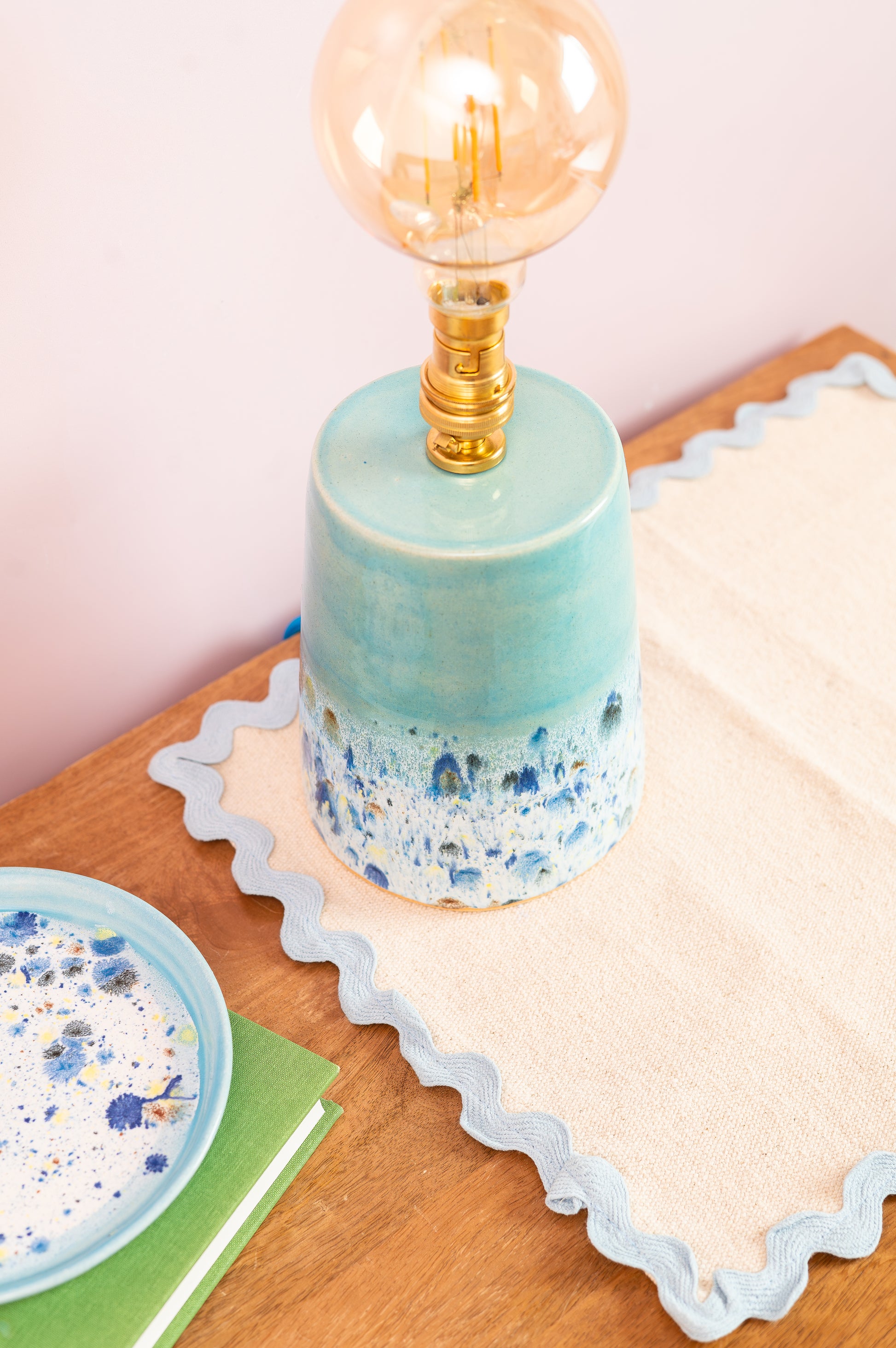 Decorative lamp with a terrazzo design on a wooden surface