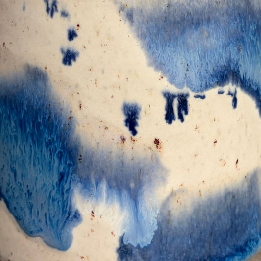 Abstract pattern of blue and white colors on a textured surface