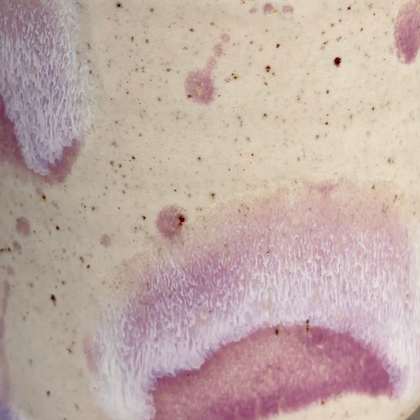 Close-up of a textured surface with purple and beige colors