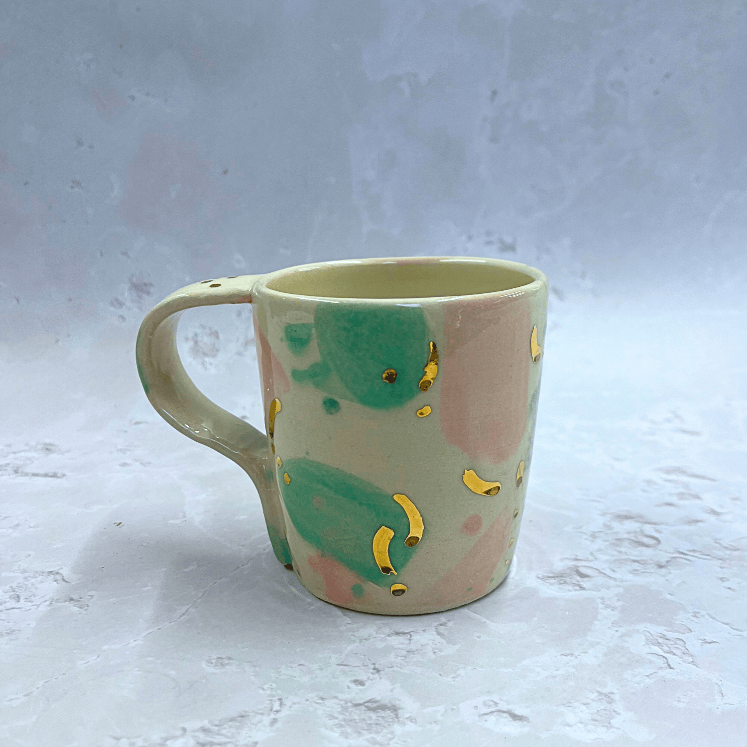 Ella Fletcher Designs Ceramic Pottery Mug in Green/Pink Sea Glass Design, mug with white background with green, pink and gold patches