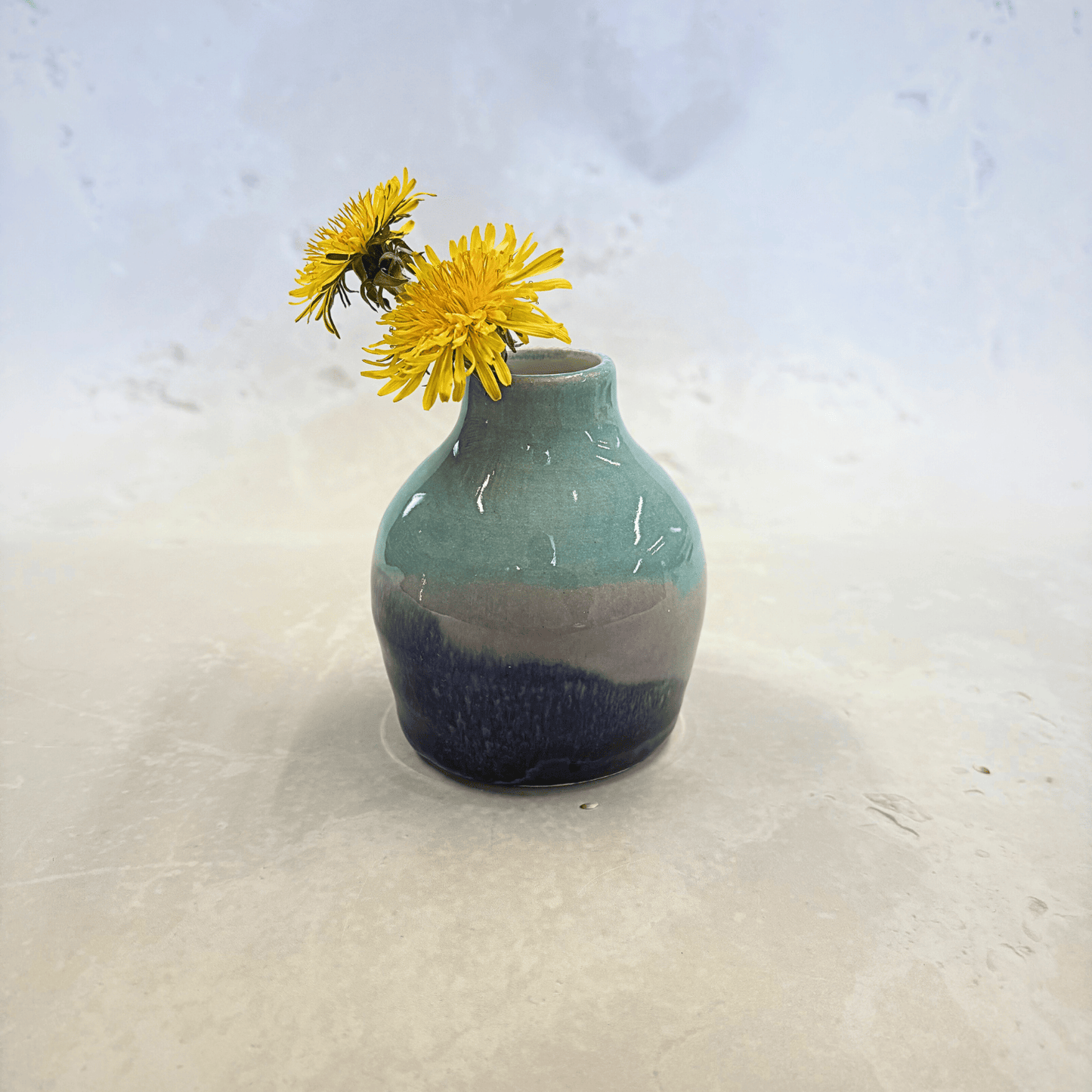 Ella Fletcher Designs Handmade Ceramics bud vase in Scottish Sunrise landscape design, small vase with layers of pinks and light and dark blues