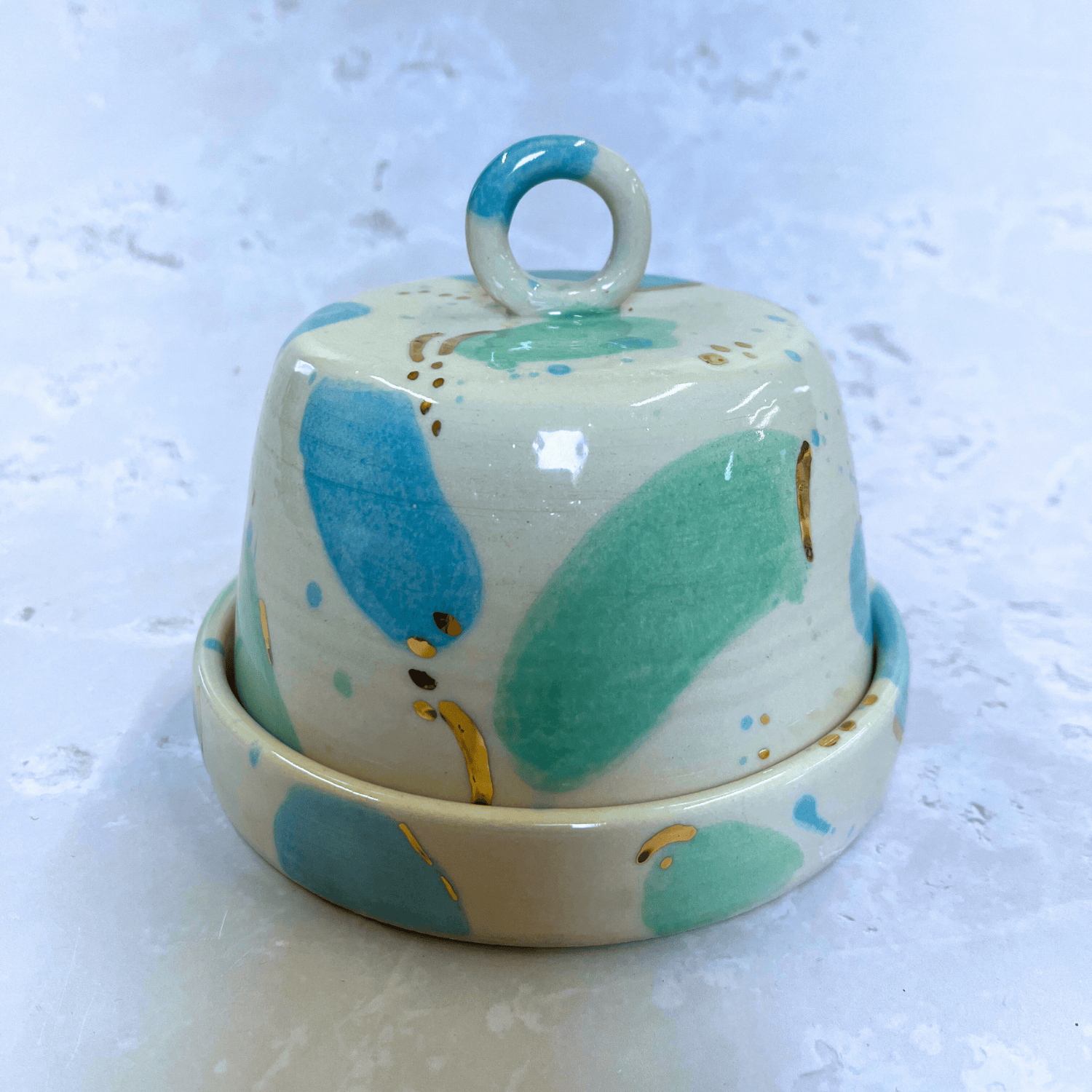 Ella Fletcher Designs Handmade Ceramic Butter Dish in Green & Blue Sea Glass, domed lid and dish with blobs of green and blue with gold speckle