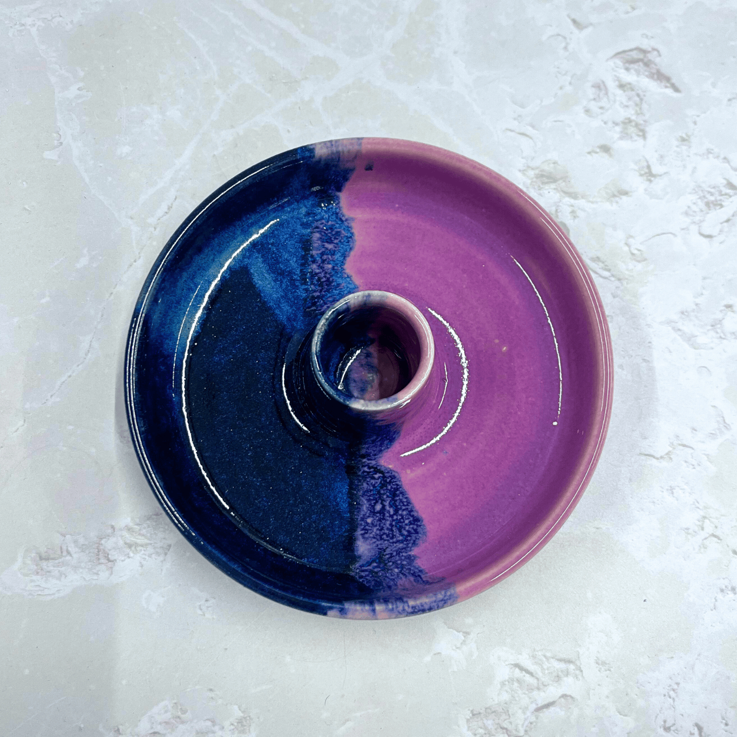 Ella Fletcher Designs Handmade Ceramic Candlestick holder in Pink Scottish Landscape design, circular candlestick holder with layered dark and light blues and pinks featured from above