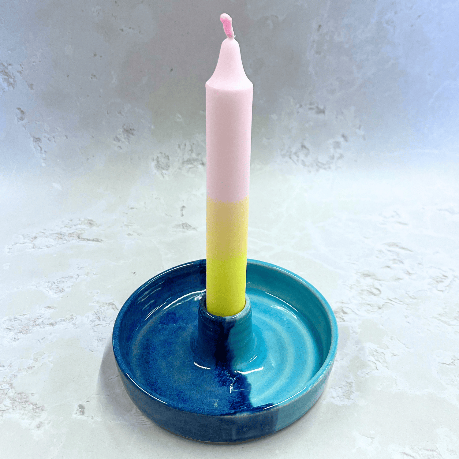 Ella Fletcher Designs Handmade Ceramic Candlestick holder in Blue Scottish Landscape design, circular candlestick holder with layered dark and light blues featuring a candle