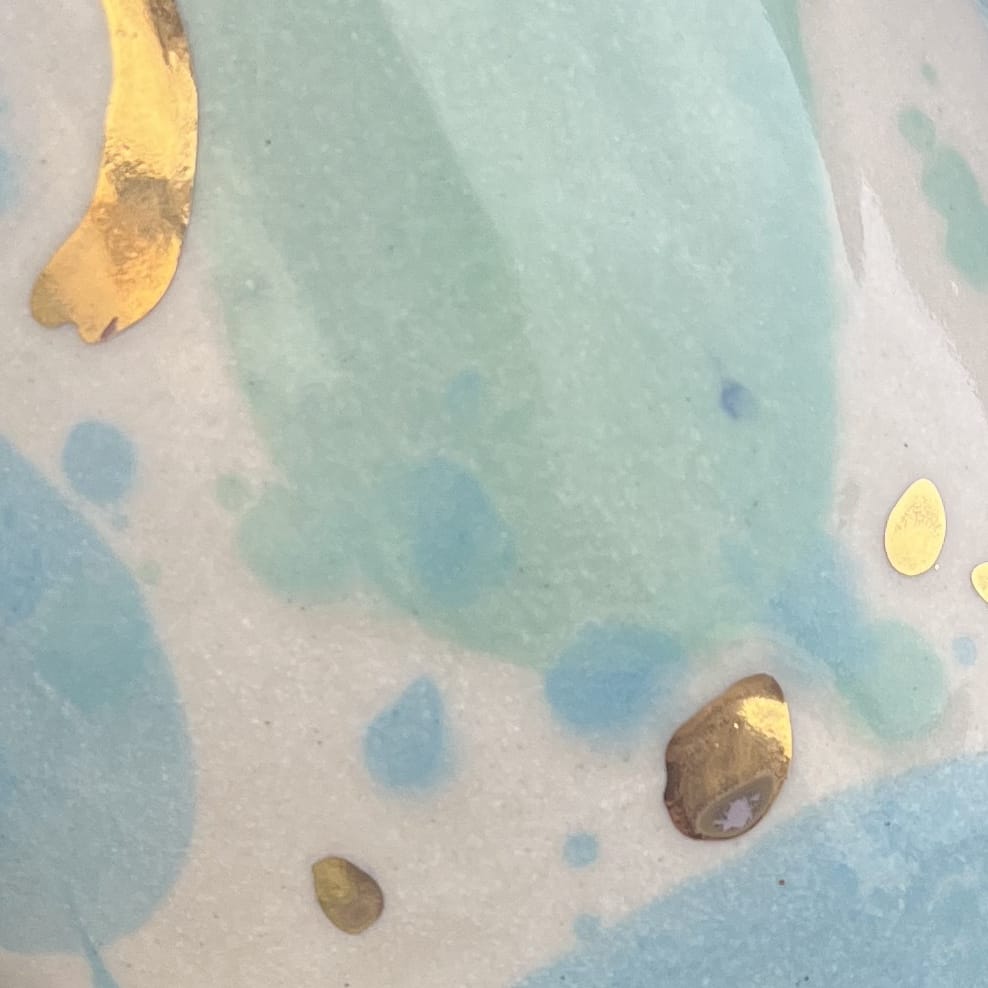 Ella Fletcher Designs Handmade Ceramic Green/Blue Sea Glass Design, white background with green, blue and gold patches
