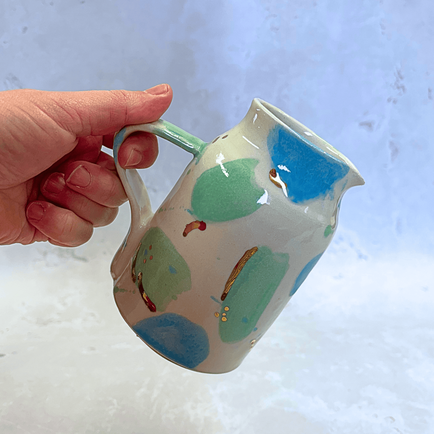 Ella Fletcher Designs Handmade Ceramic Jug in Green & Blue Sea Glass, jug with spots of blue and green with speckles of gold