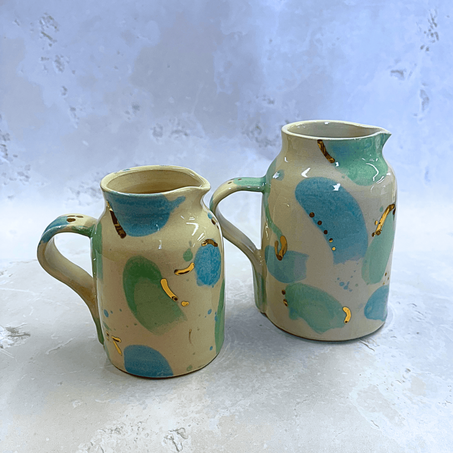 Ella Fletcher Designs Handmade Ceramic Jugs in Green & Blue Sea Glass, small and medium jugs with spots of blue and green with speckles of gold