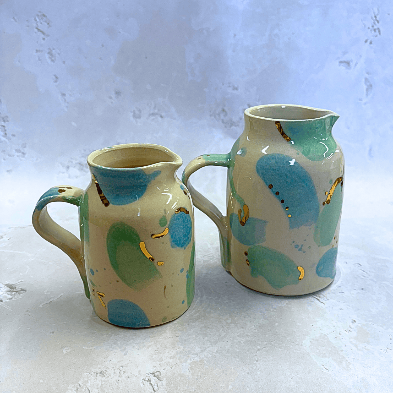 Ella Fletcher Designs Handmade Ceramic Jugs in Green & Blue Sea Glass, small and medium jugs with spots of blue and green with speckles of gold