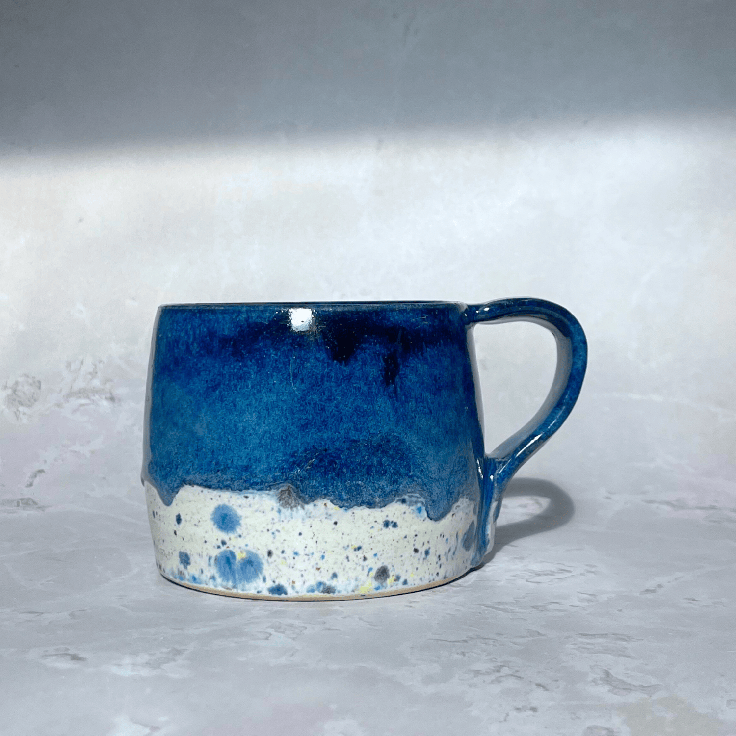 Ella Fletcher Designs Handmade Ceramics Round Large Mug in Navy Shoreline with dark blue and multi-coloured speckled design