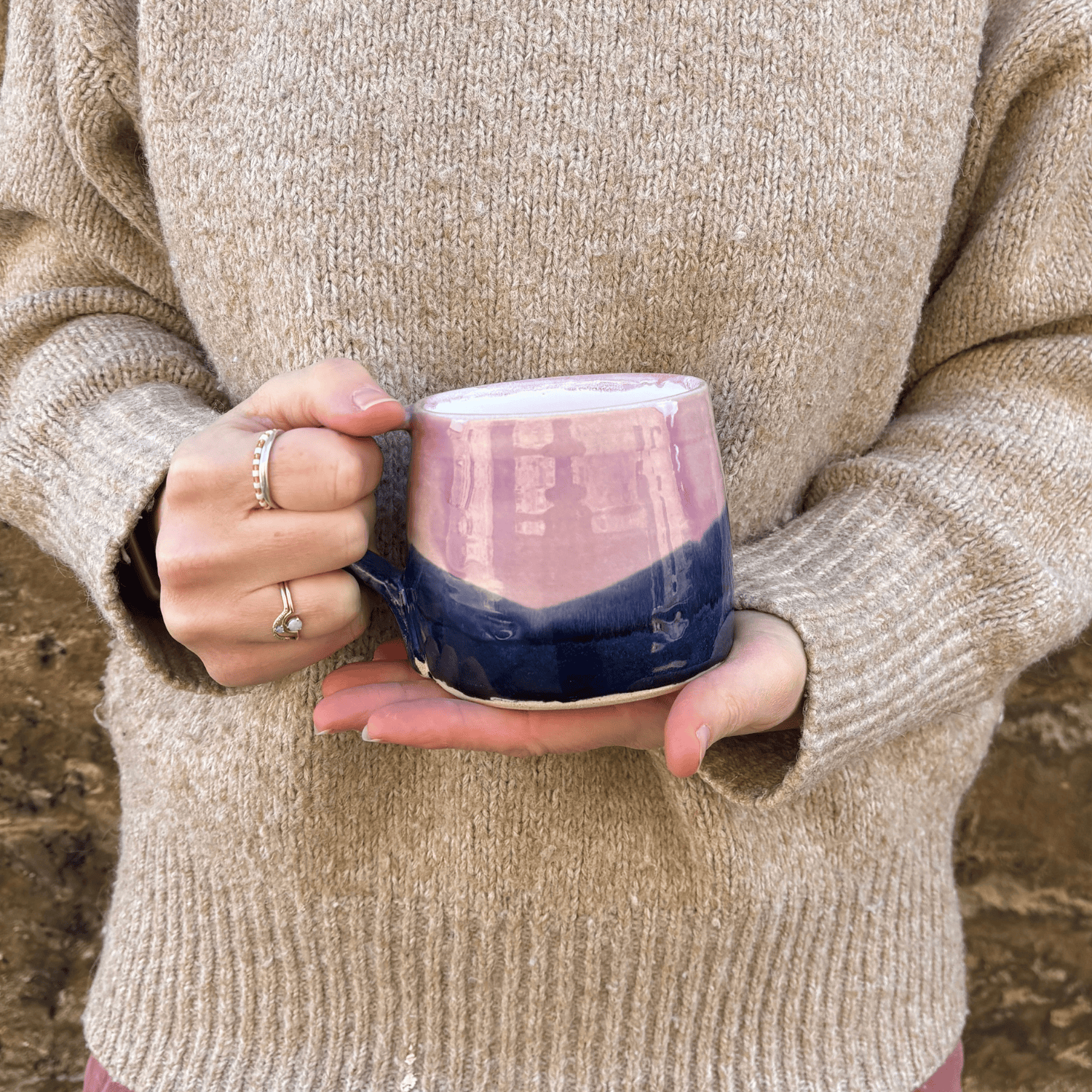 Ella Fletcher Designs Handmade Ceramic Large Round Mug in Pink Landscape design, large mug being held featuring layers of pinks and blues