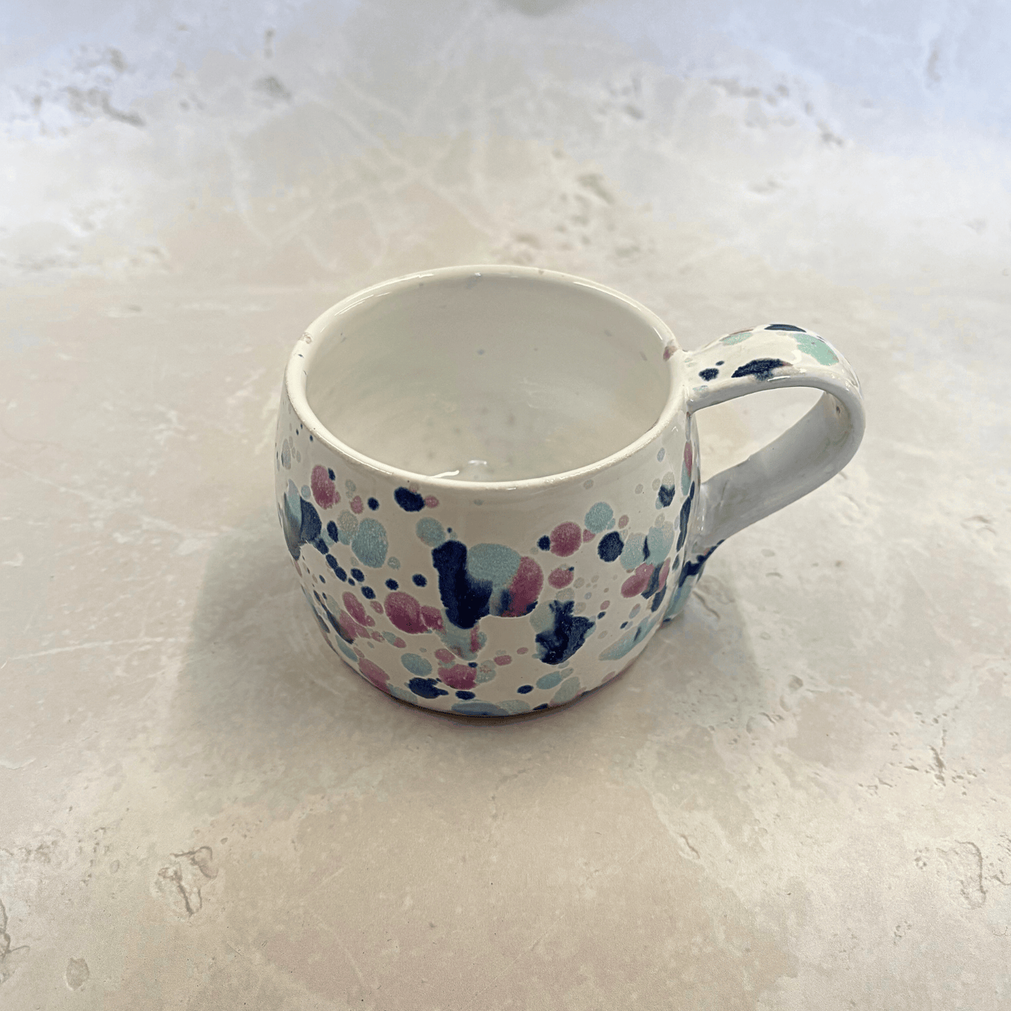 Ella Fletcher Designs Handmade Ceramic UK Large Round Mug in Sweepea design, round mug featuring splashes of blues, pinks and green