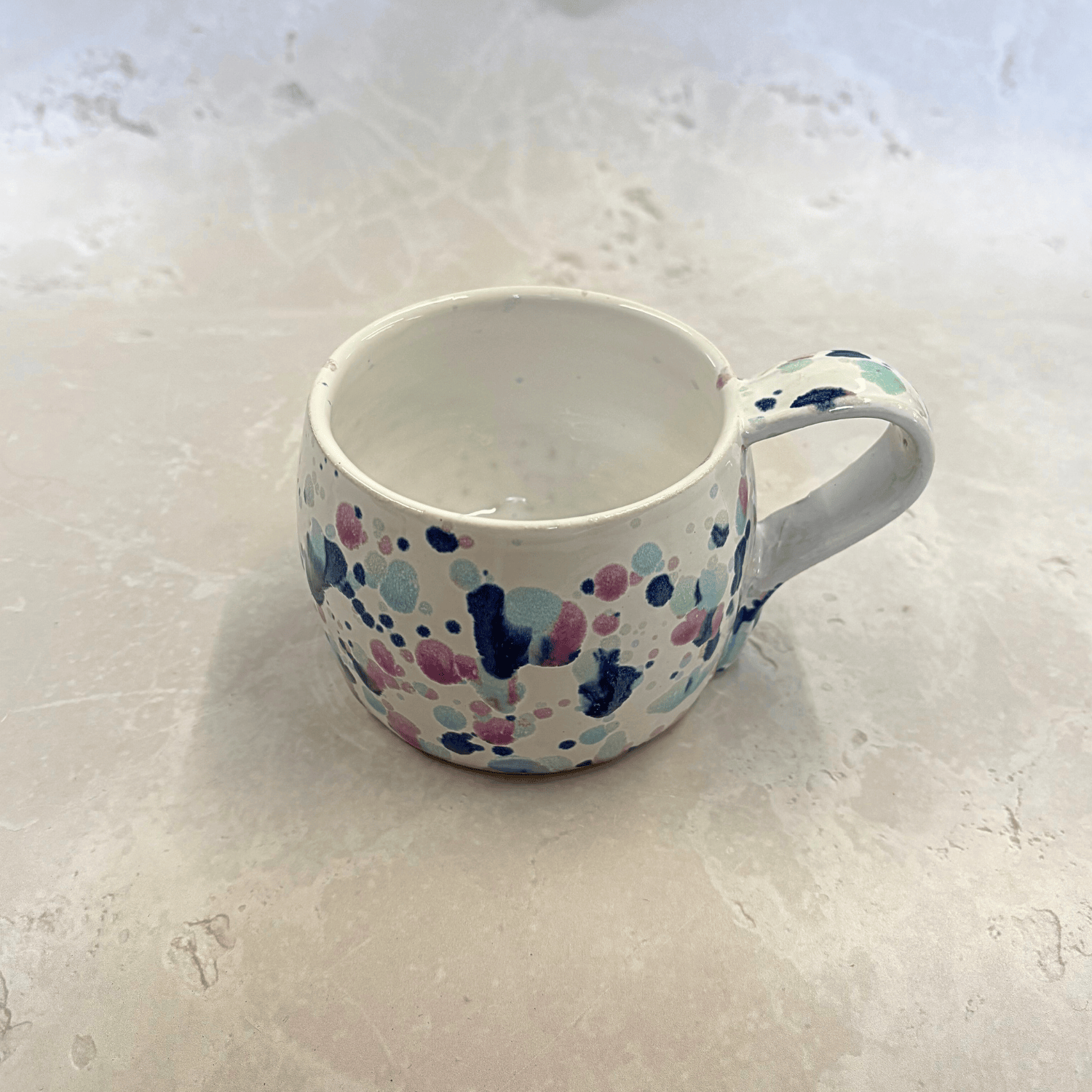 Ella Fletcher Designs Handmade Ceramic UK Large Round Mug in Sweepea design, round mug featuring splashes of blues, pinks and green