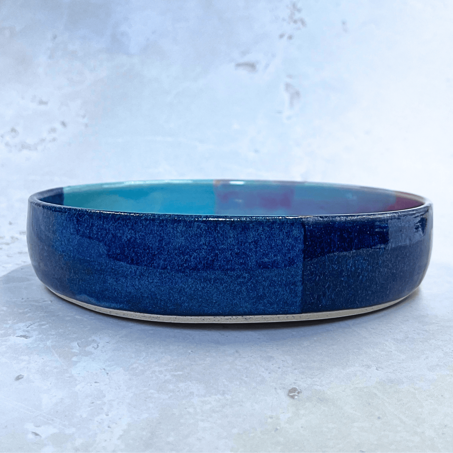 Ella Fletcher Designs Handmade Ceramic Pasta Bowl in Scottish Sunrise Landscape - pasta bowl with layers of blues and pinks, showcasing depth of the bowl