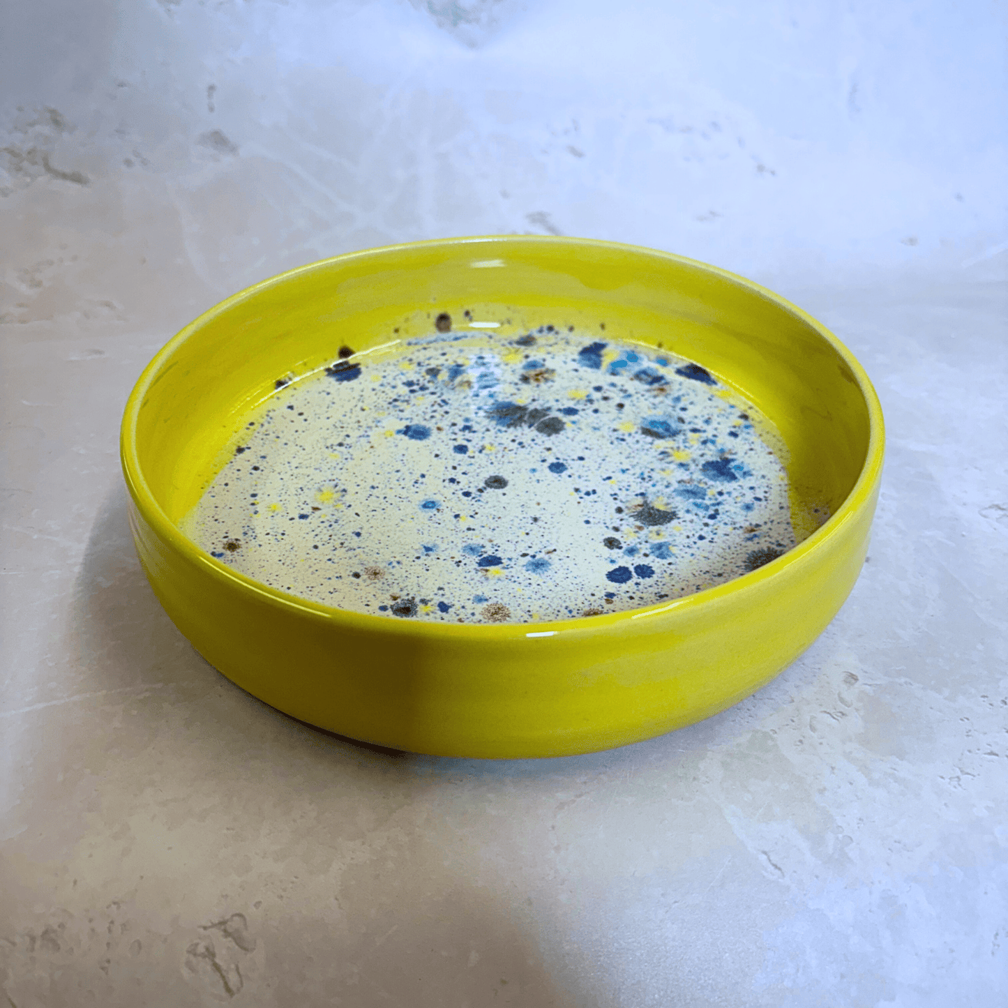 Ella Fletcher Designs Handmade Ceramic Pasta Bowl in Yellow Shoreline, yellow rimmed pasta bowl with multicoloured speckles inside