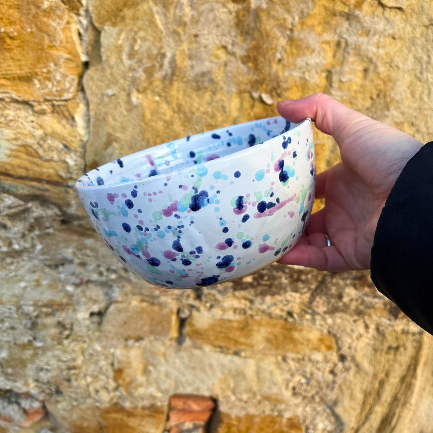 Ella Fletcher Designs Handmade Ceramic Ramen Bowl in sweetpea design being held