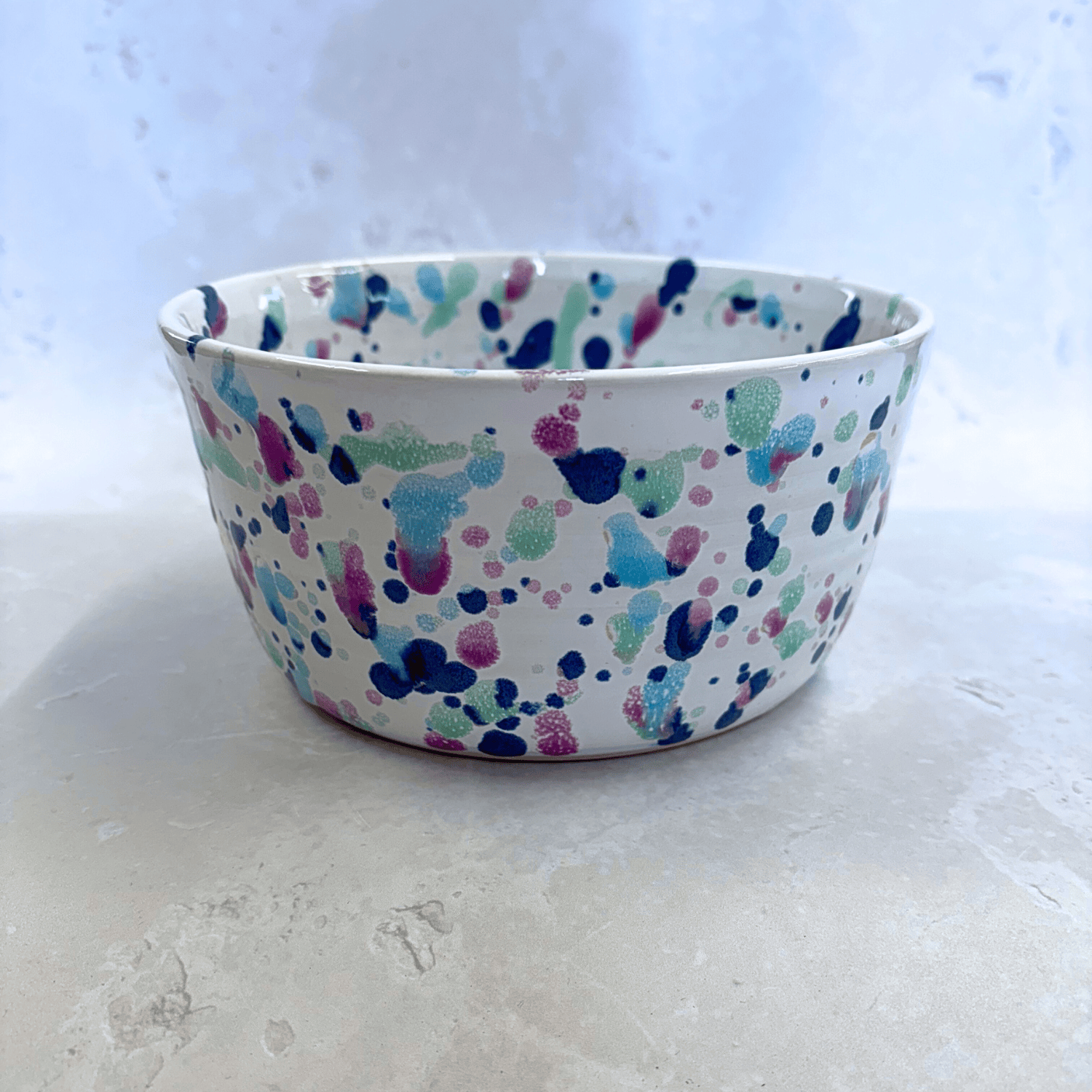 Ella Fletcher Designs Handmade UK Ceramic Ramen Bowl in Sweetpea Design, bowl with white background speckled with blues, pinks and greens