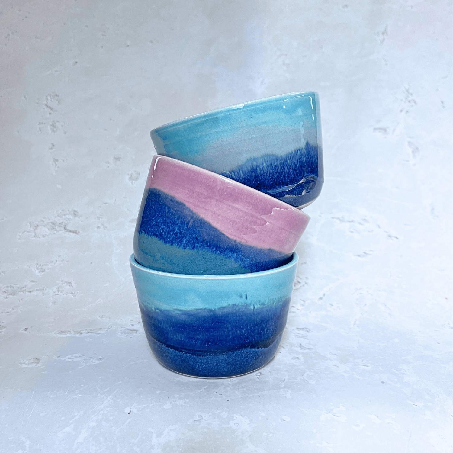 Ella Fletcher Designs Handmade Ceramic small bowls in landscape, stacked range of landscape bowls featuring blues and pinks in layers