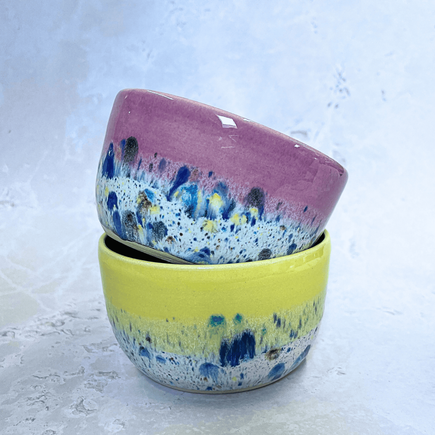 Ella Fletcher Designs Handmade Ceramic Small Bowls in Pink and Yellow Shoreline design, round stacked bowls in pink and yellow with multicolour speckles