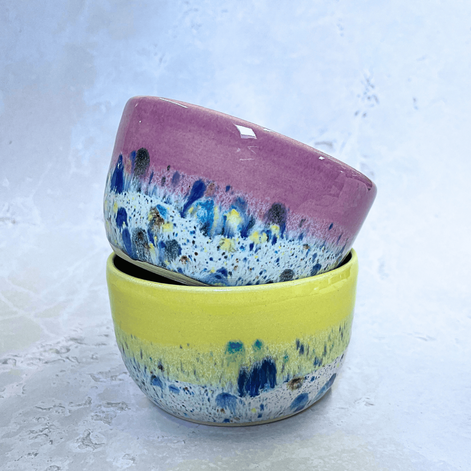 Ella Fletcher Designs Handmade Ceramic Small Bowls in Pink and Yellow Shoreline design, round stacked bowls in pink and yellow with multicolour speckles