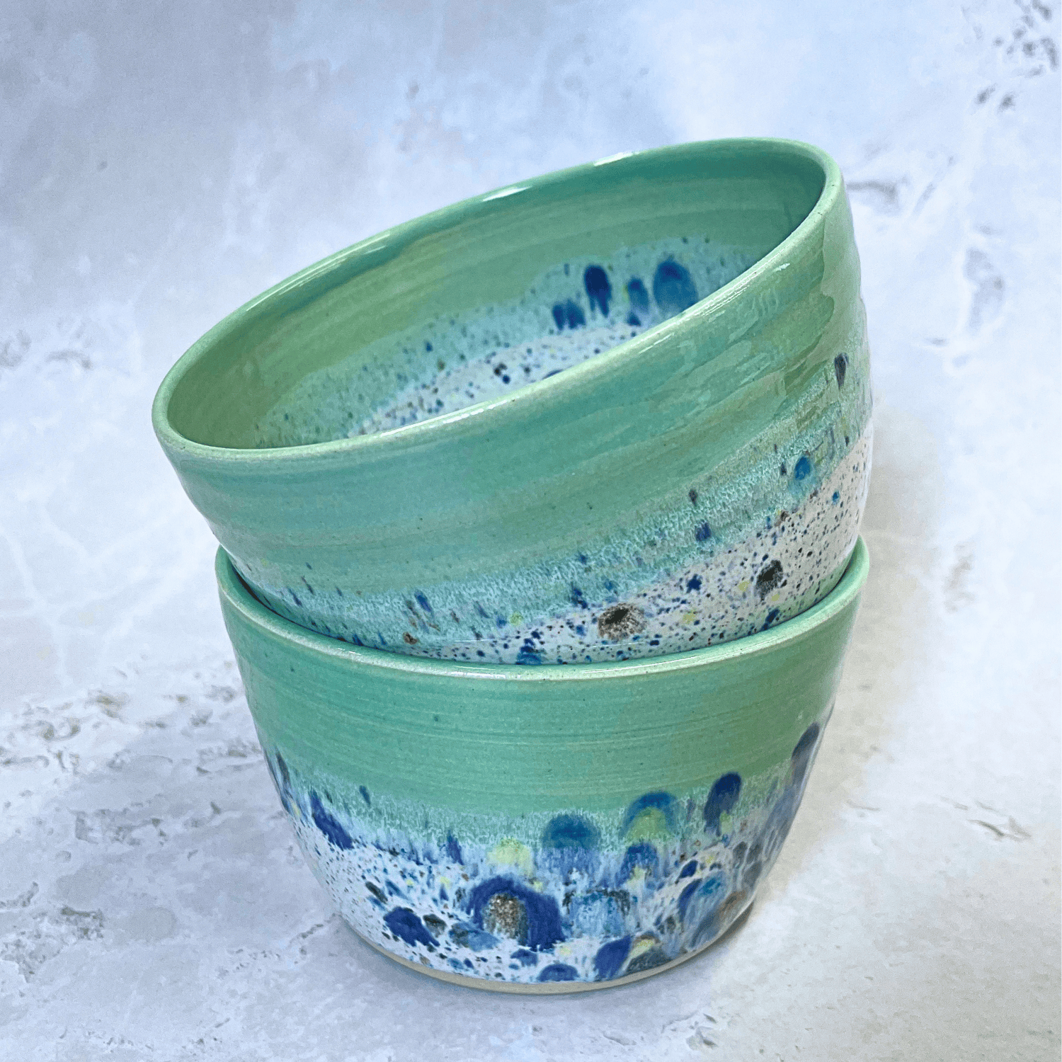 Ella Fletcher Designs UK Handmade Ceramic Small Bowls in Green Shoreline design, two stacked round green bowl with multicolour speckles