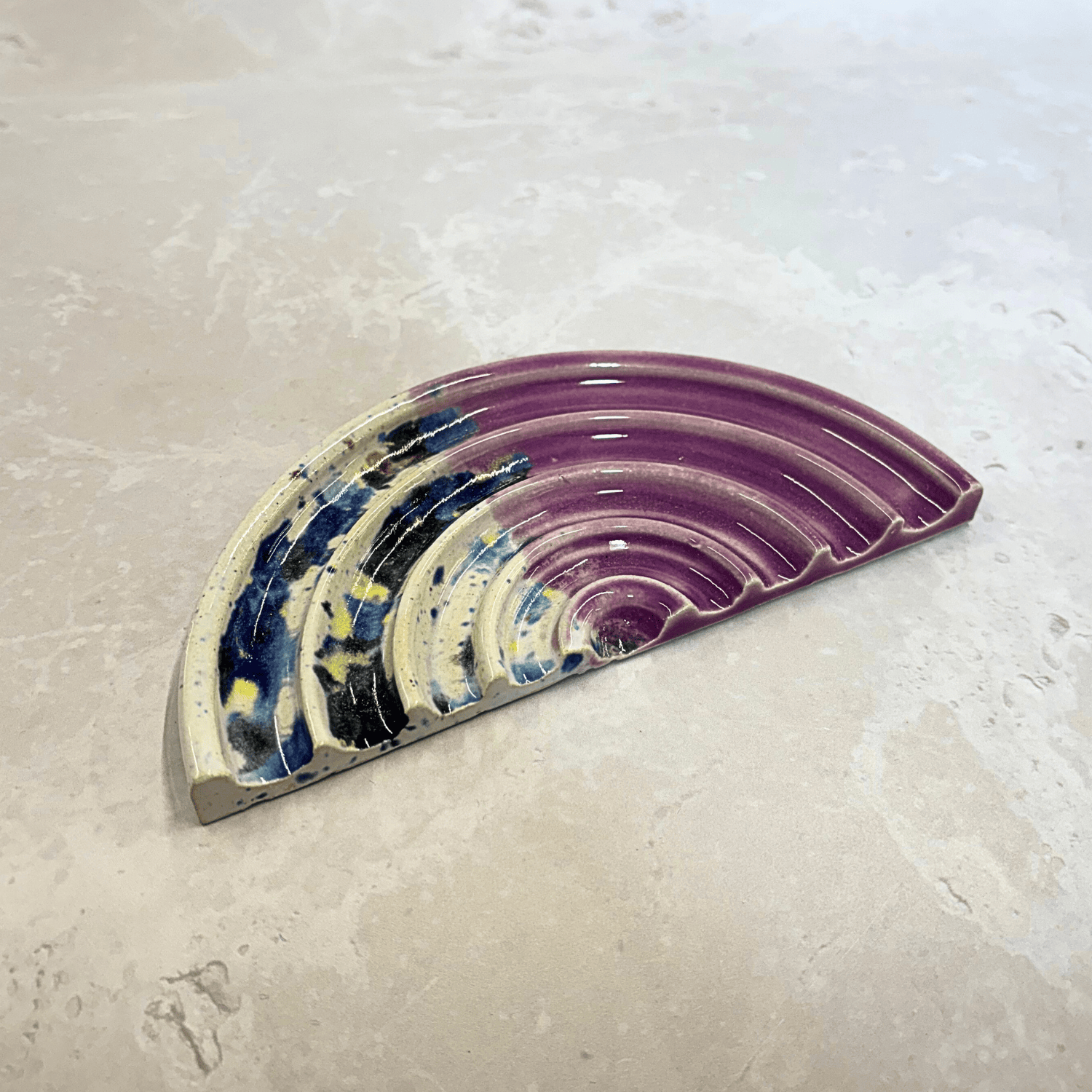 Ella Fletcher Designs Handmade Ceramics Soap Dish in Pink Shoreline design, semi-circle with grooved edges, half pink and half multi-coloured speckles