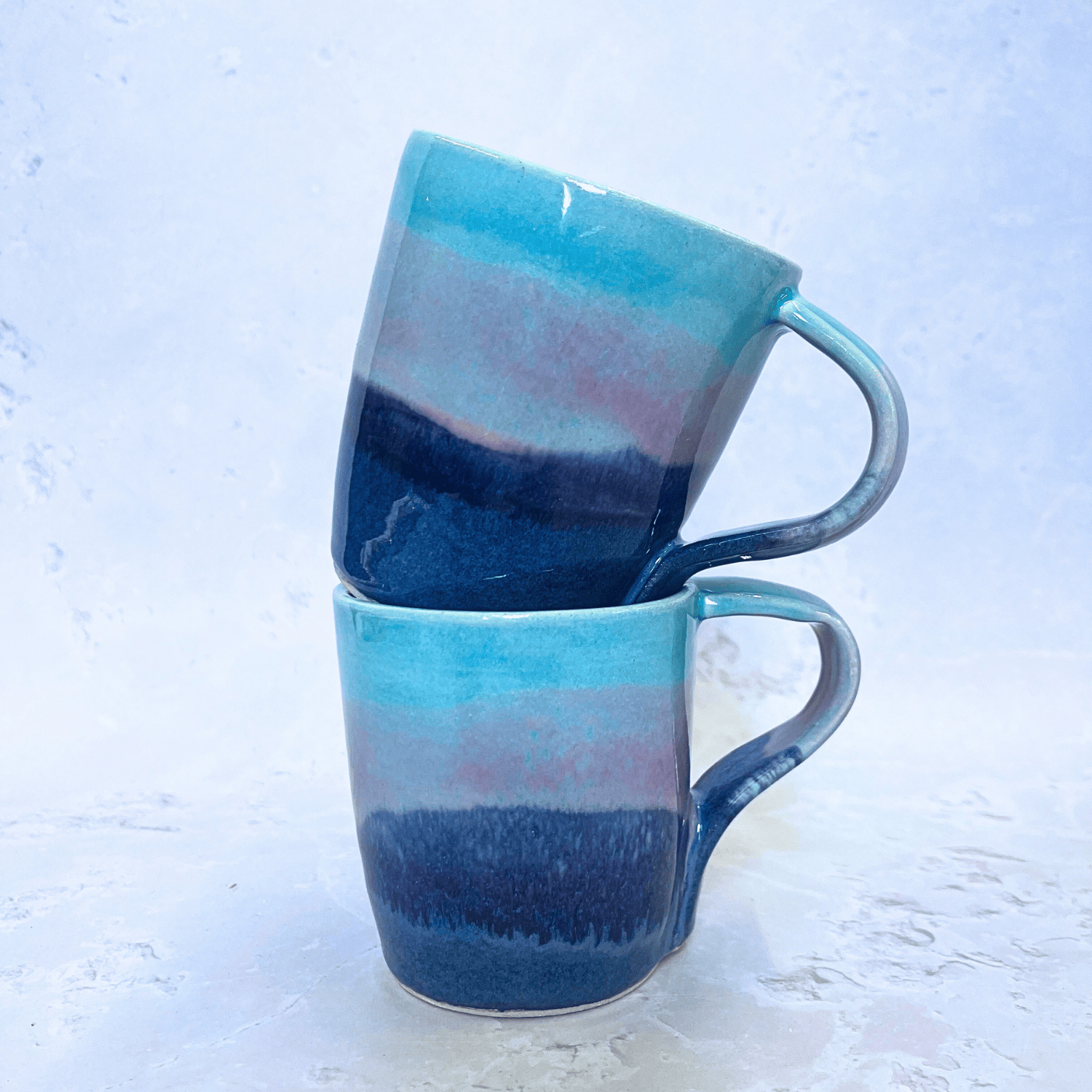 Ella Fletcher Designs Handmade Ceramics Standard Mug in Scottish Sunrise Landscape Design, layers of blues and pinks resembling the Scottish sunrise