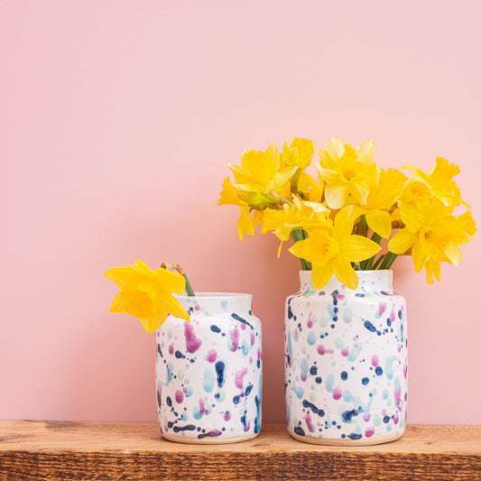 Ella Fletcher Designs Handmade Ceramic UK Sweetpea Vases, medium and large size with sweetpea design of splattered blues and pinks with daffodils inside the vases