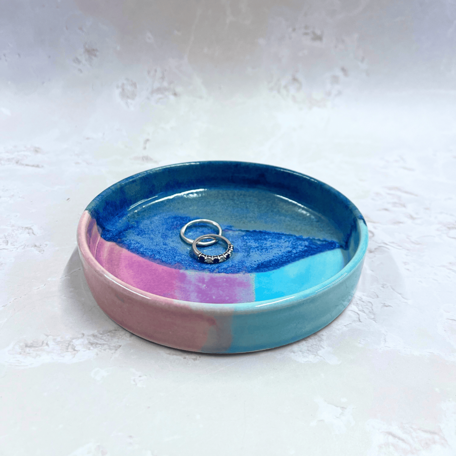 Ella Fletcher Designs Handmade Ceramic Trinket Dish in Scottish Sunrise Landscape, small round dish with layers of blues and pinks featuring rings