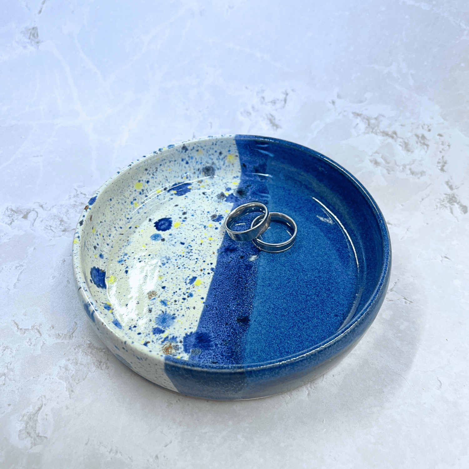 Ella Fletcher Designs Handmade Ceramics Trinket Dish in Navy Shoreline Design, small round dish with navy and multicolour speckles featured with rings inside