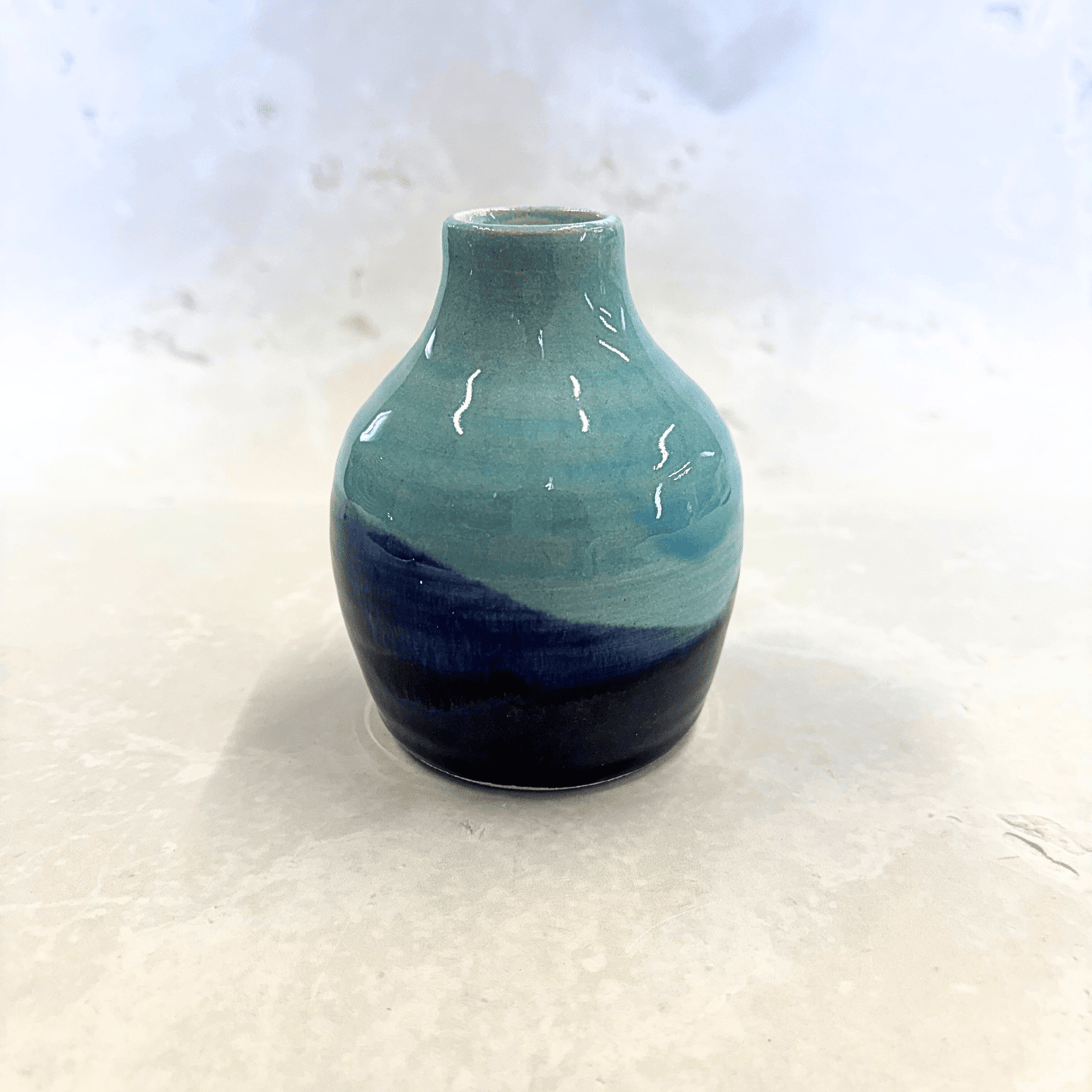 Ella Fletcher Designs Handmade Ceramics bud vase in blue landscape design, small vase with layers of blues