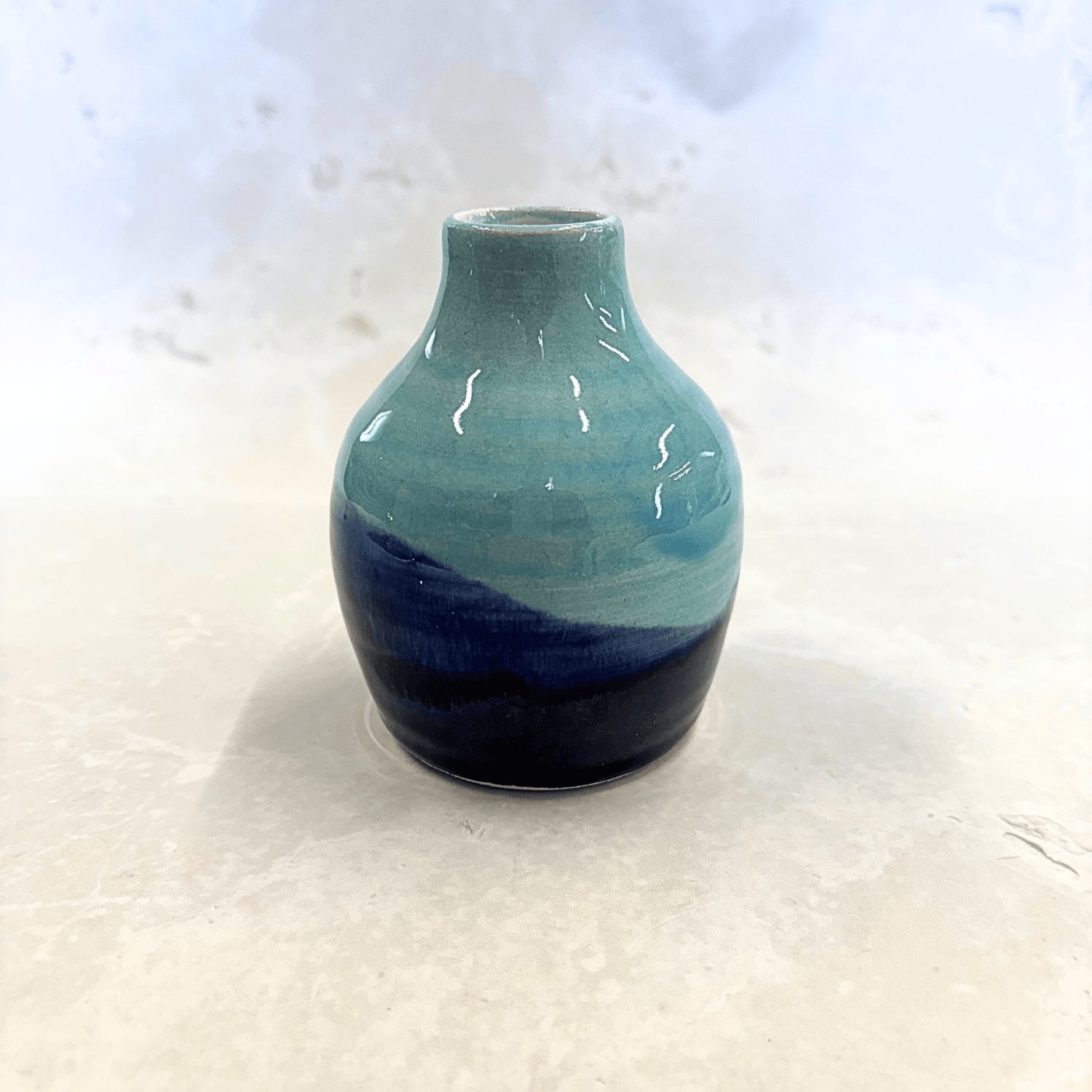 Ella Fletcher Designs Handmade Ceramics bud vase in blue landscape design, small vase with layers of blues