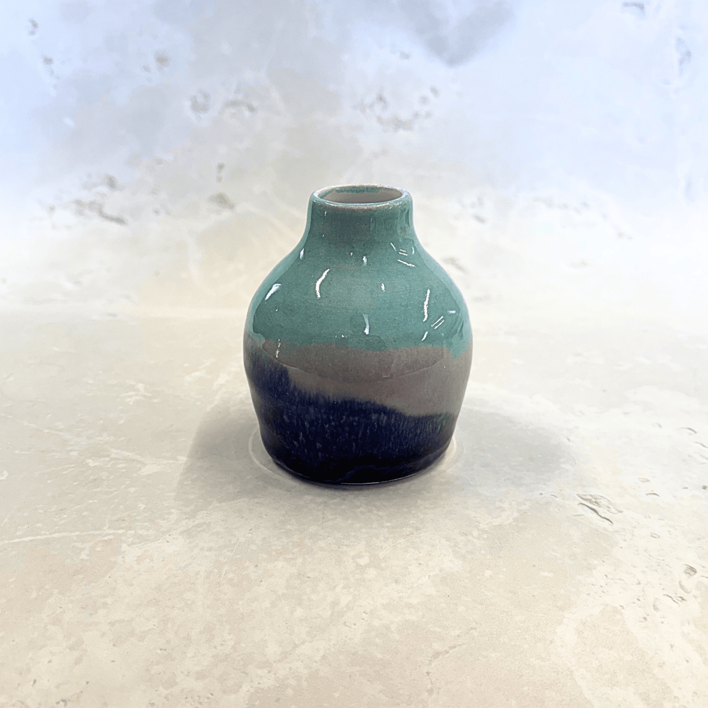 Ella Fletcher Designs Handmade Ceramics bud vase in Scottish Sunrise landscape design, small vase with layers of pinks and light and dark blues