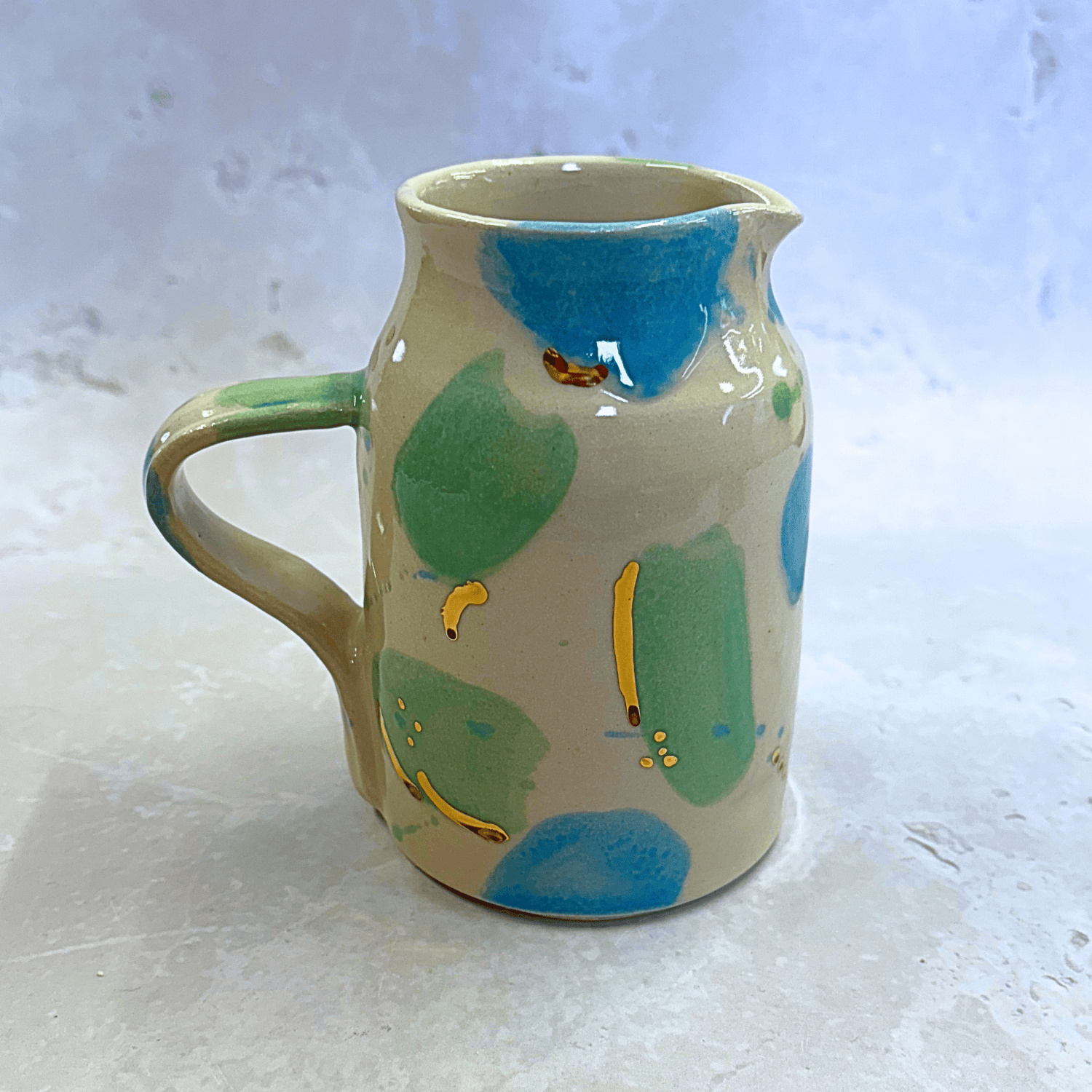 Ella Fletcher Designs UK Handmade Ceramic Jug in Green & Blue Sea Glass, jug with spots of blue and green with speckles of gold